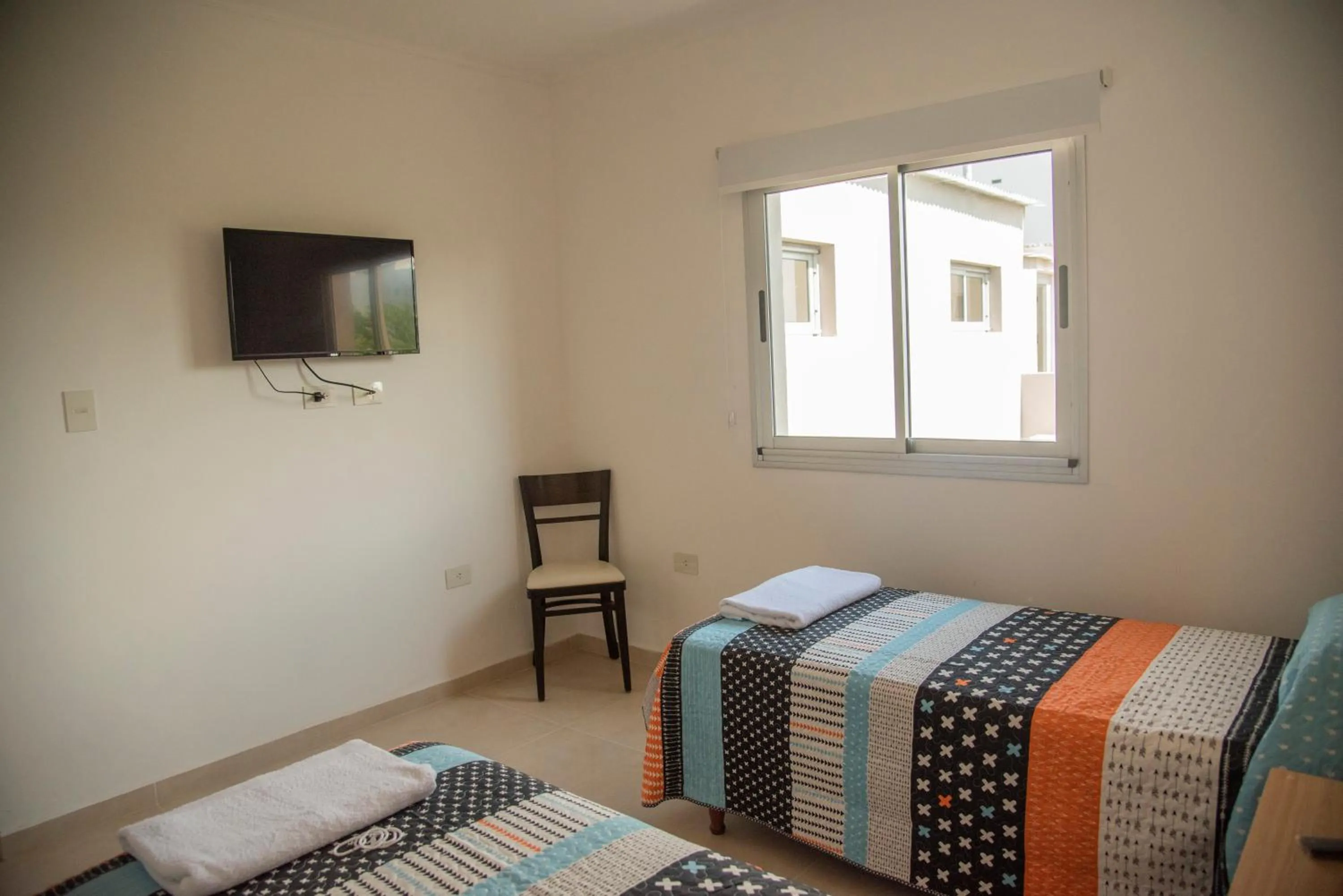 Bed in Morada Suites