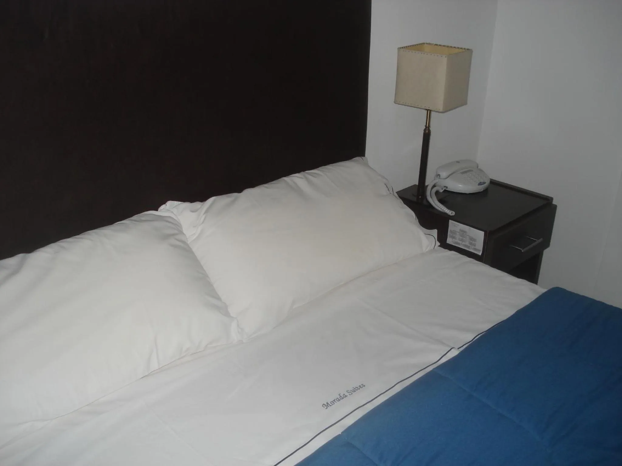 Bed in Morada Suites