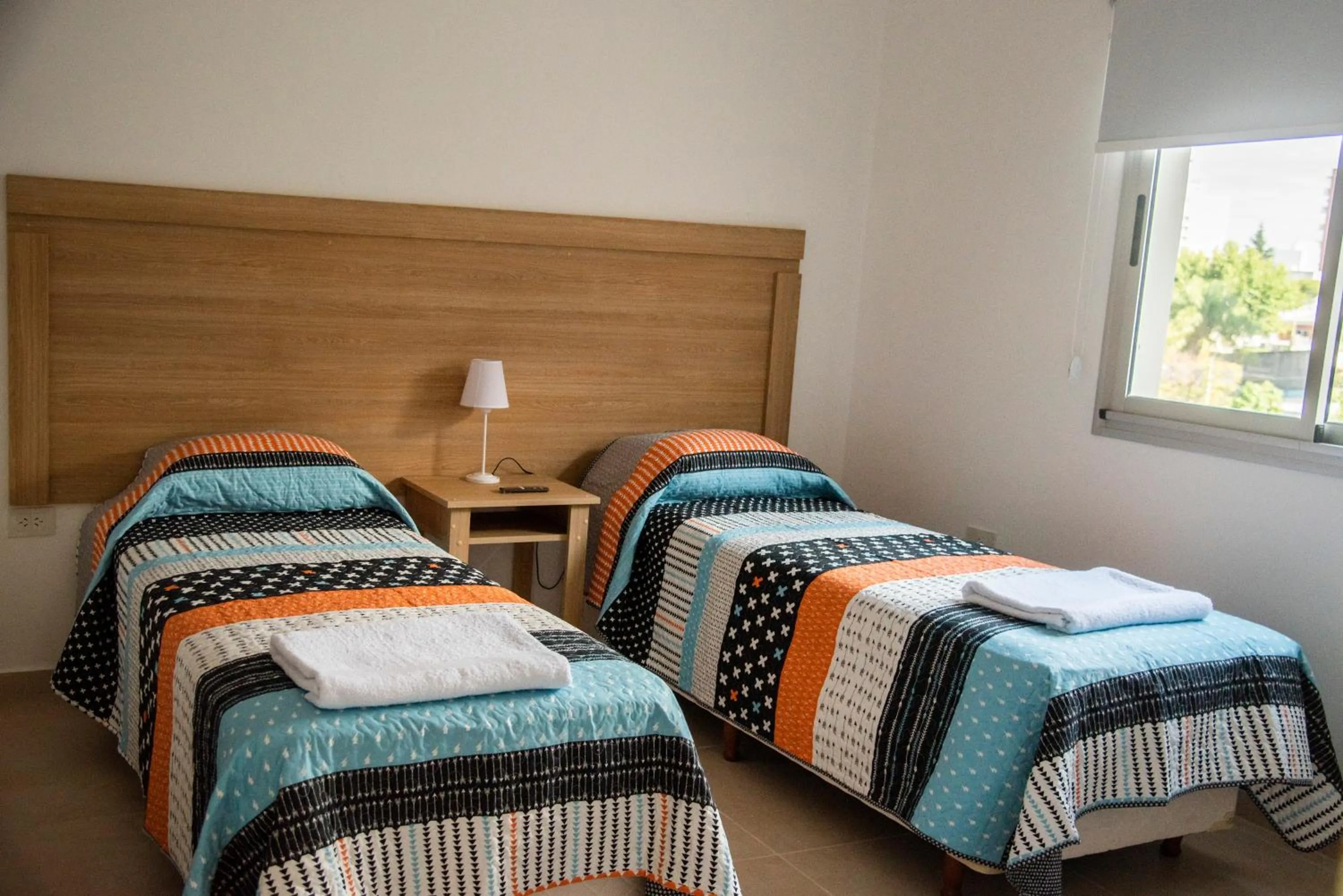 Bed in Morada Suites