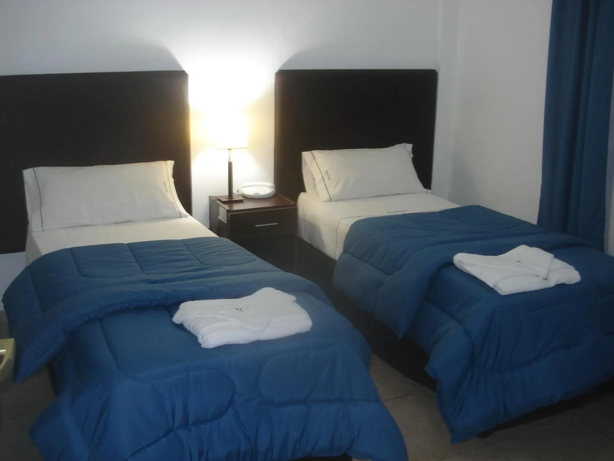 Bed in Morada Suites