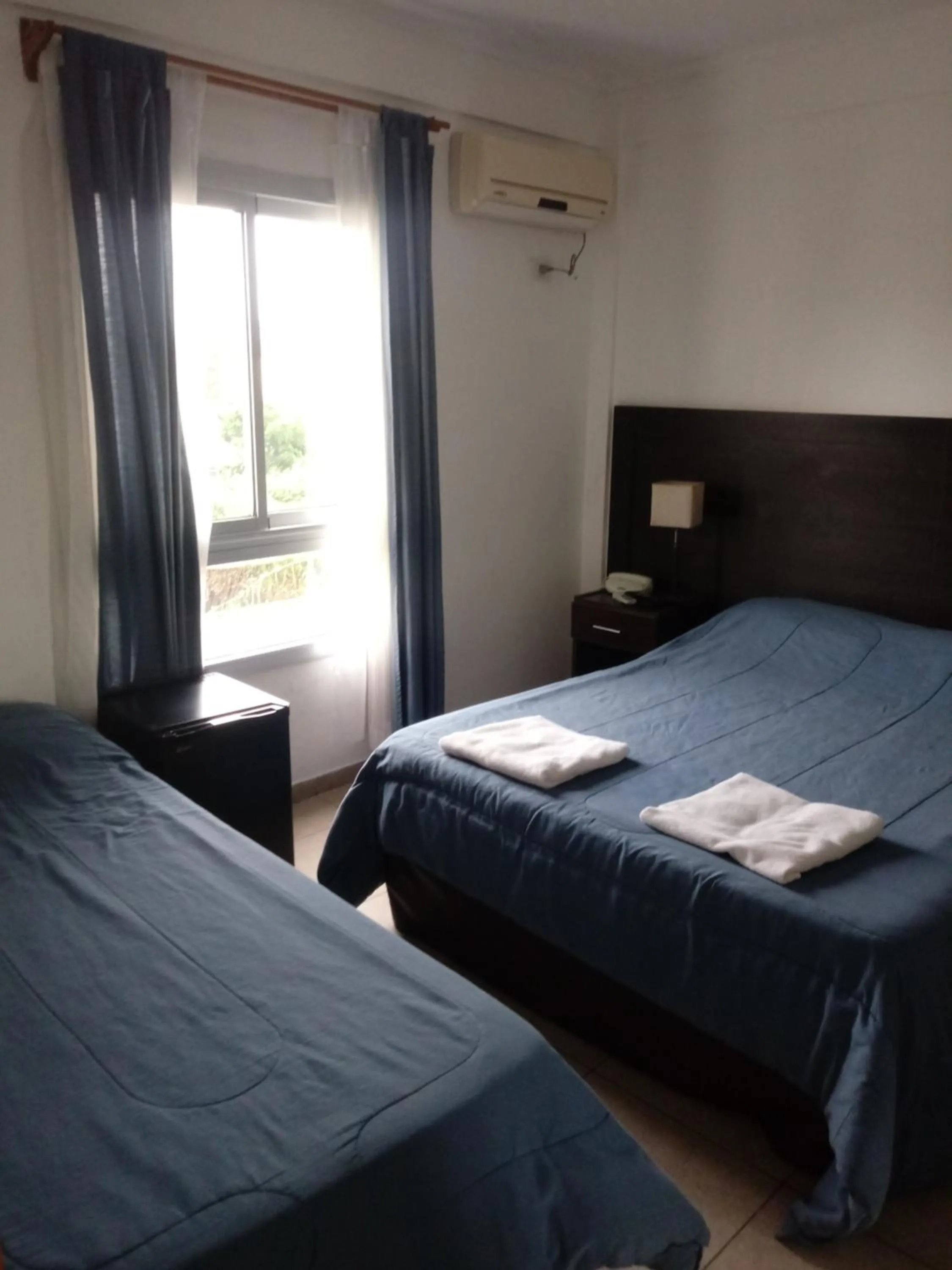 Bed in Morada Suites