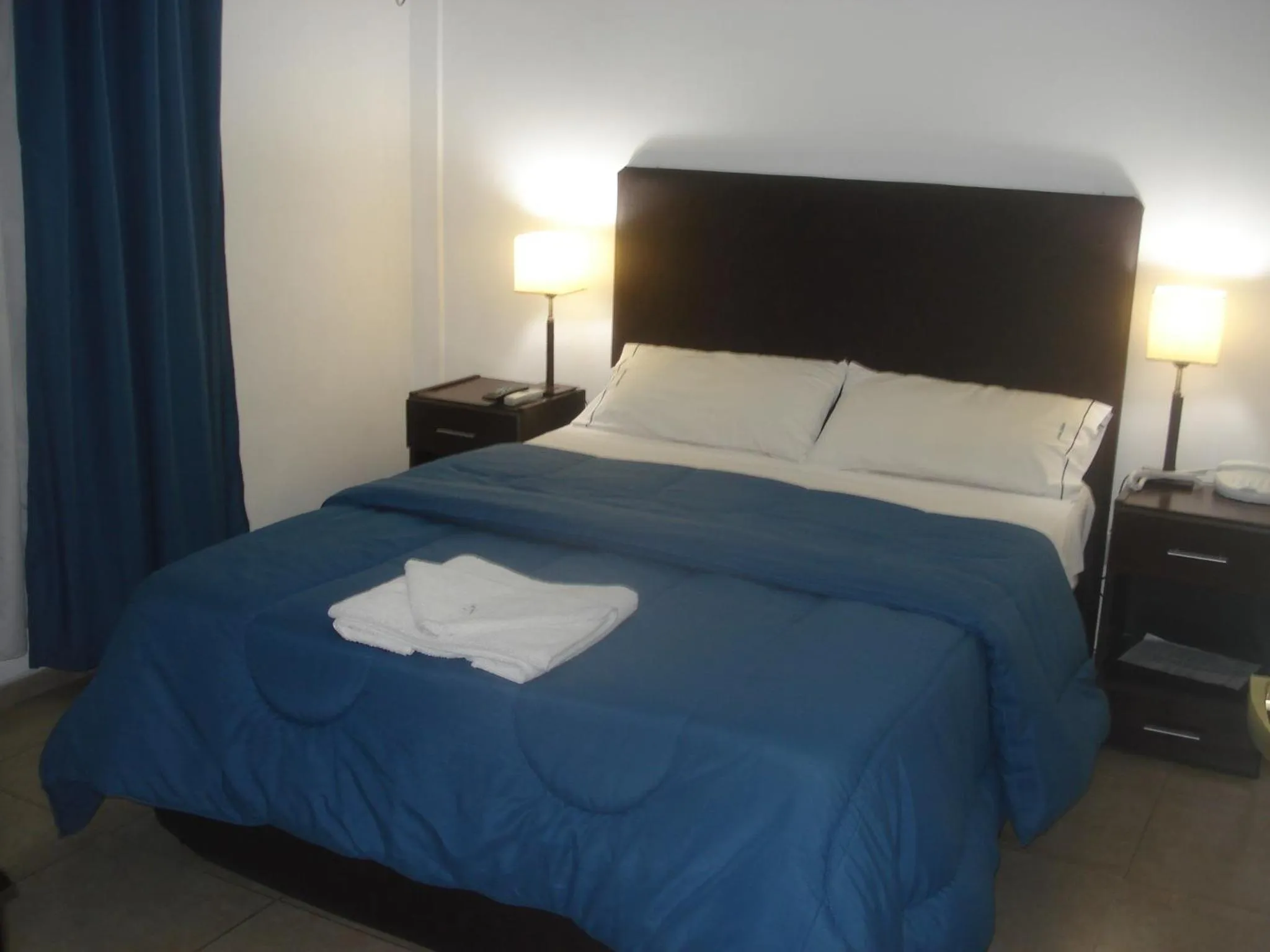 Bed in Morada Suites