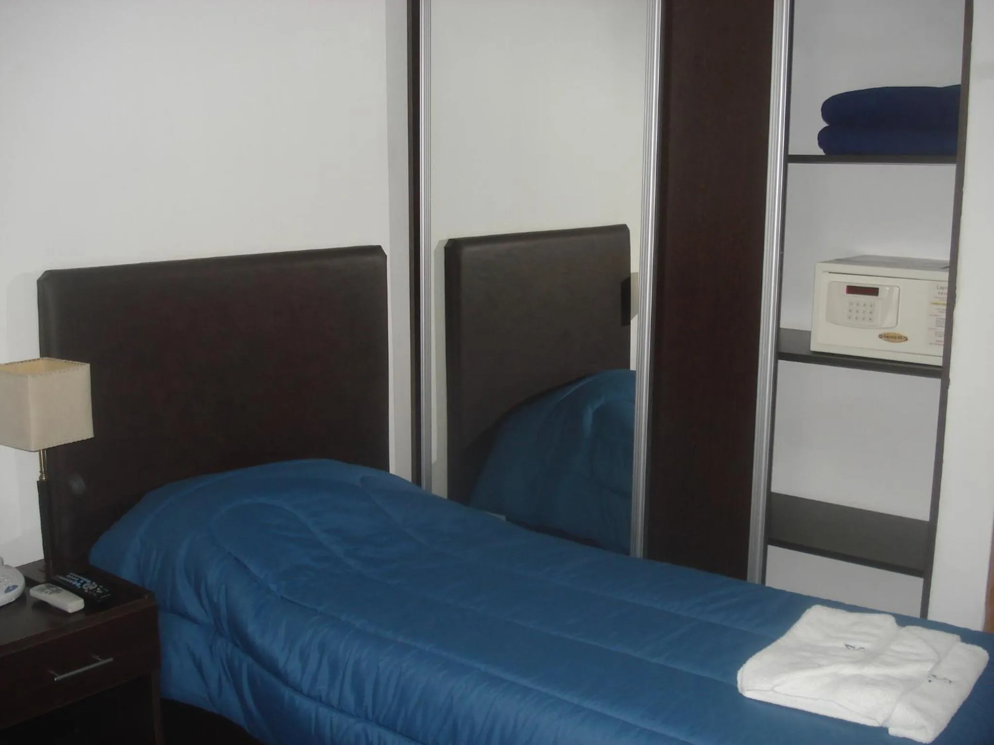 Bed in Morada Suites