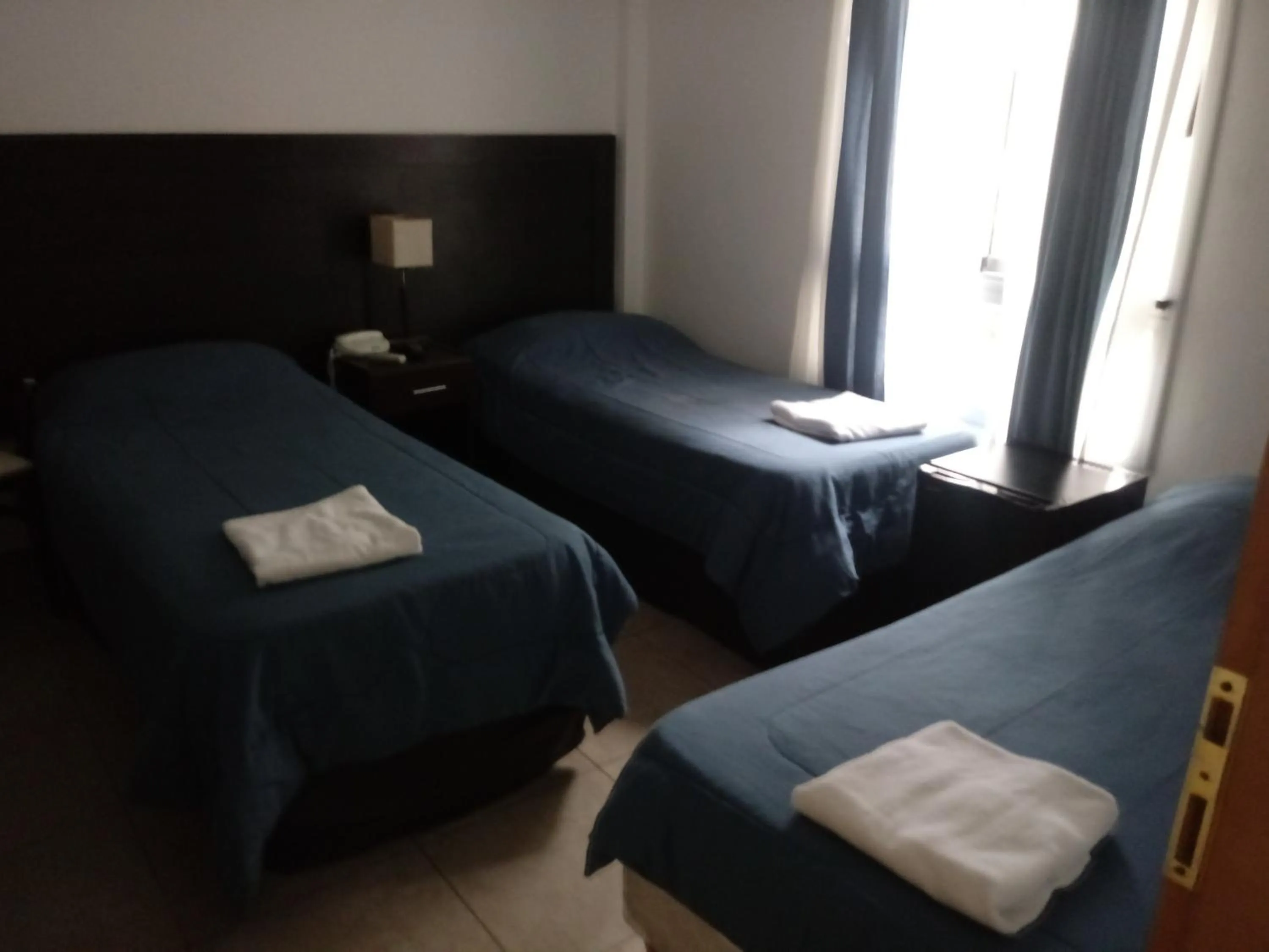 Bed in Morada Suites