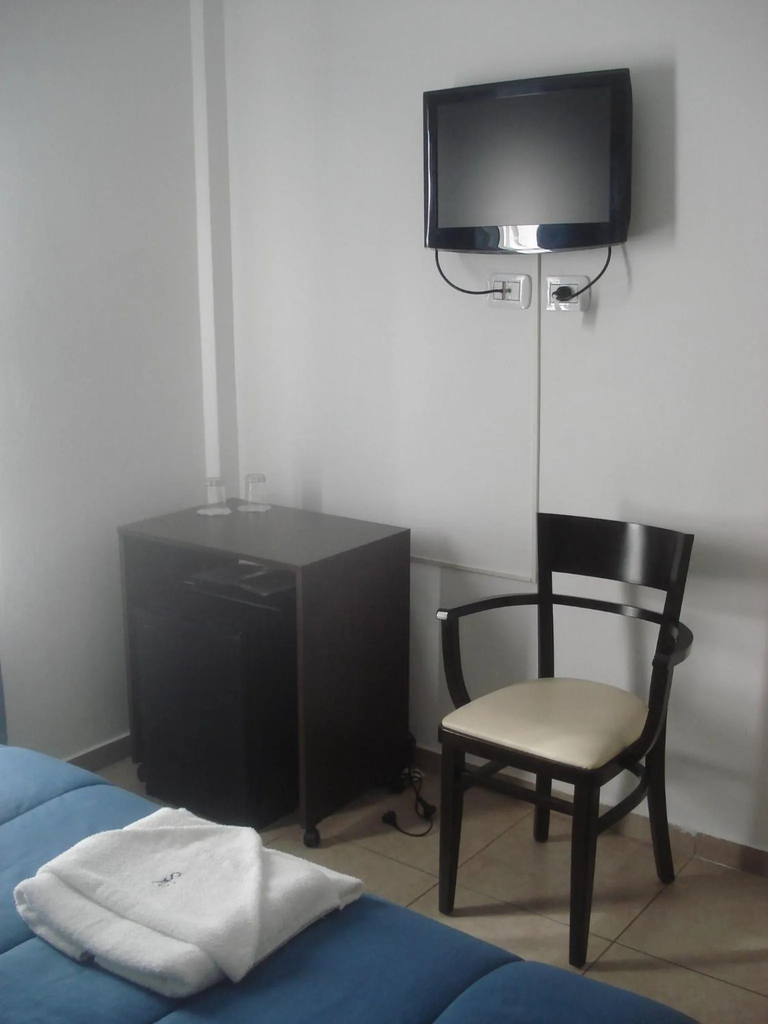 Bed in Morada Suites