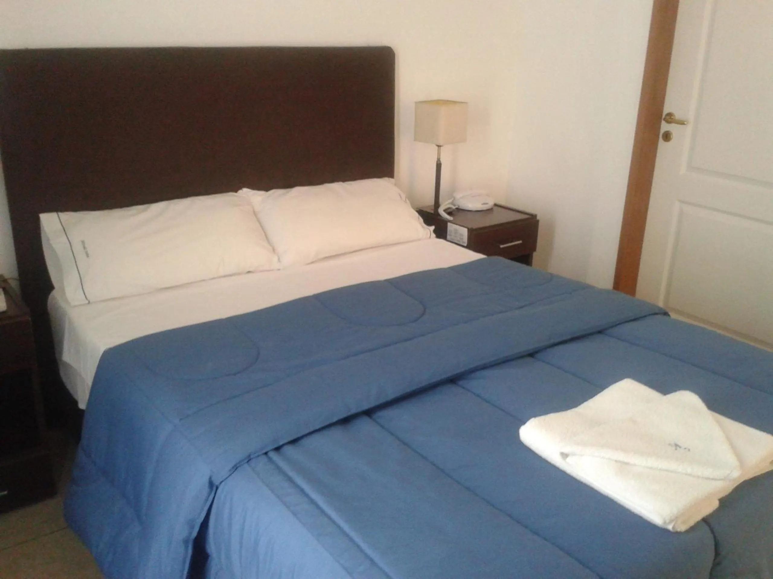 Bed in Morada Suites