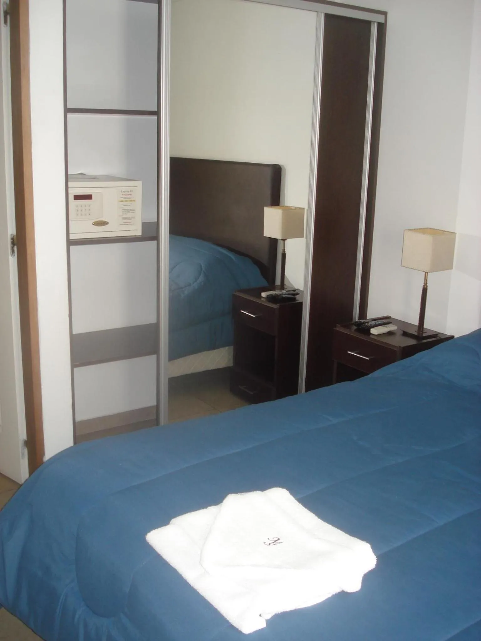 Bed in Morada Suites