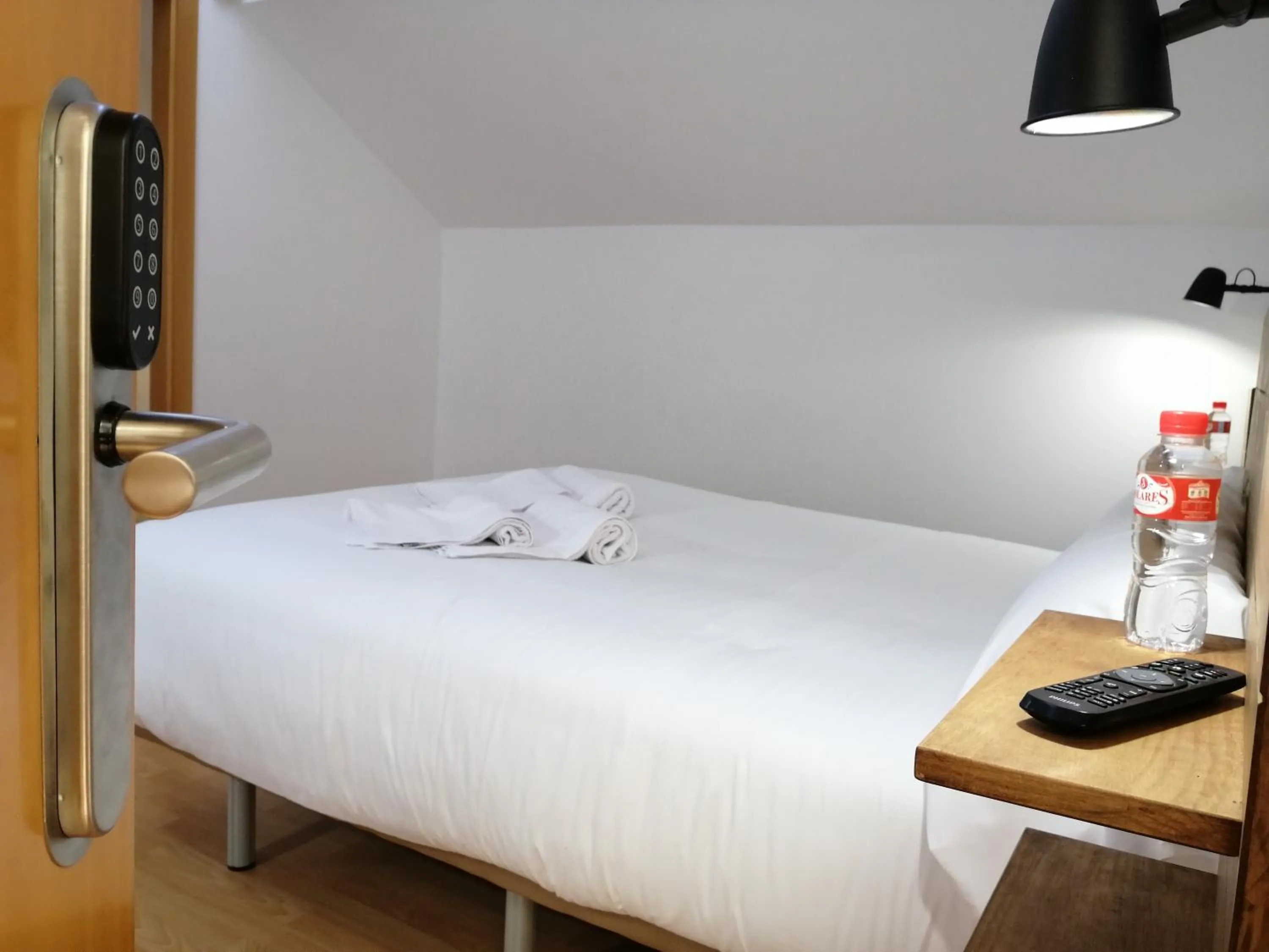 Bed in Hostal Cuéntame Evolución Auto Check in