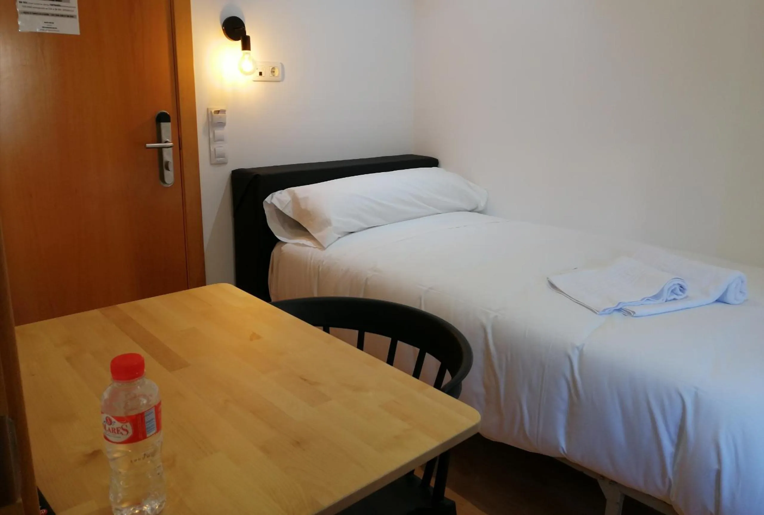 Bed in Hostal Cuéntame Evolución Auto Check in