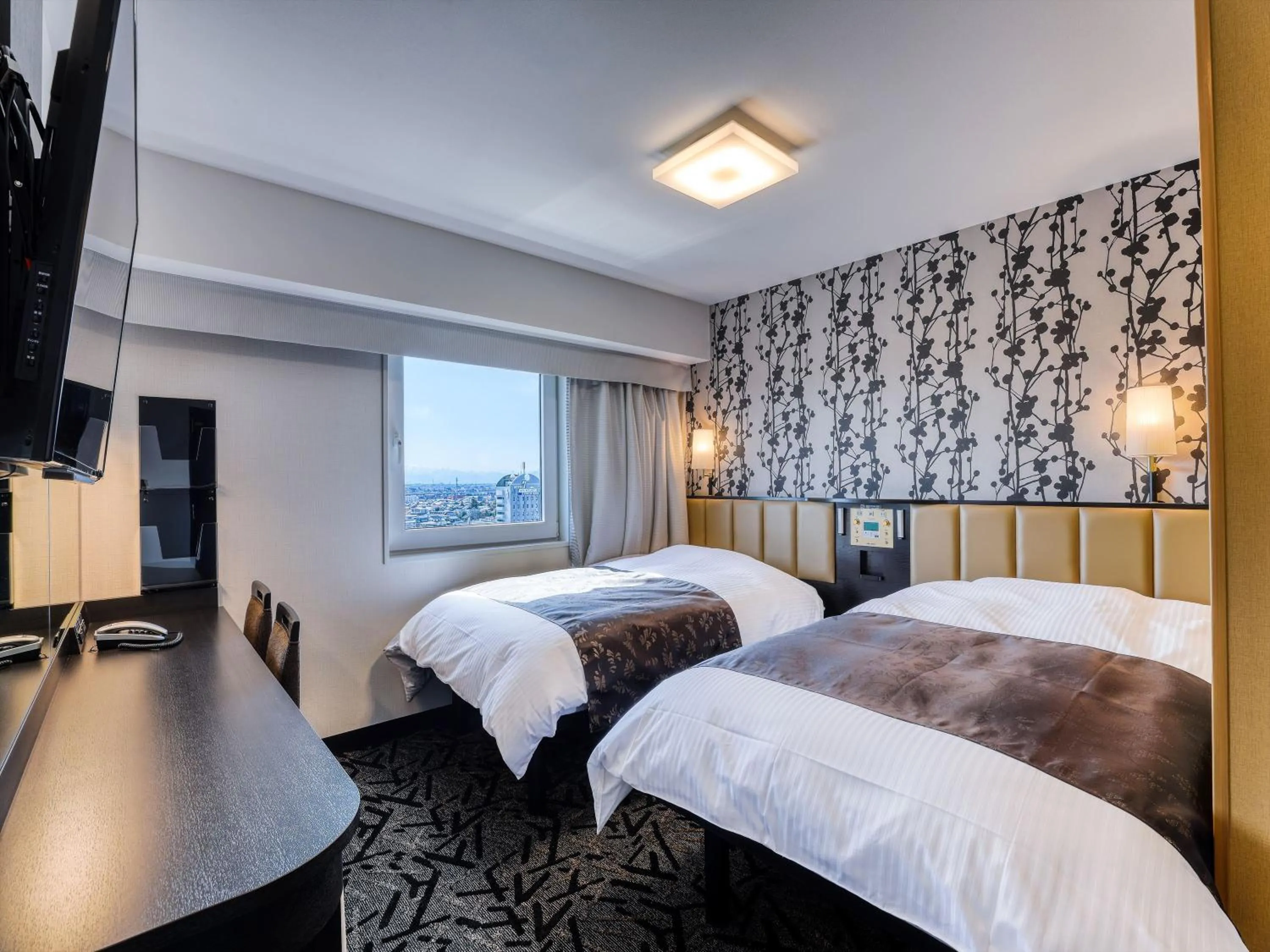 Photo of the whole room, Bed in APA Hotel Takaoka Ekimae