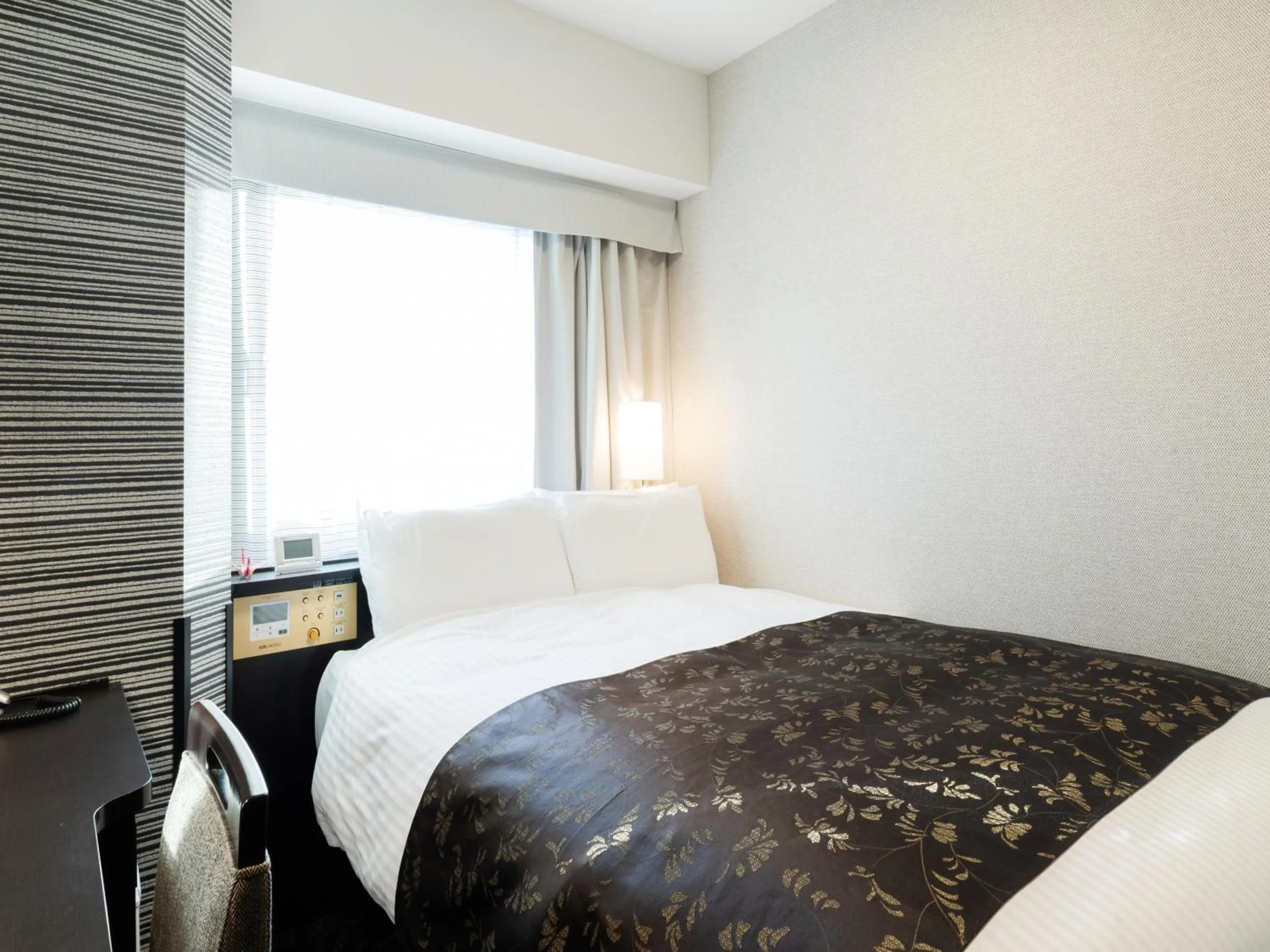 Photo of the whole room, Bed in APA Hotel Takaoka Ekimae