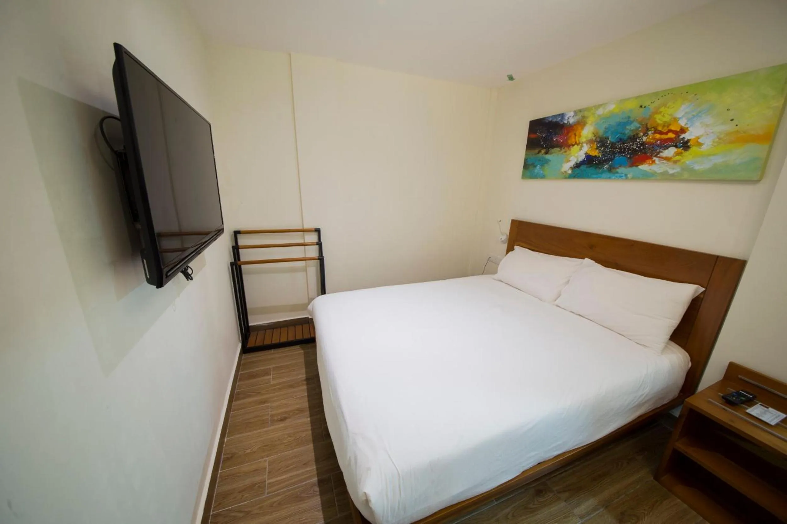 Bed in The Point Boutique Hotel