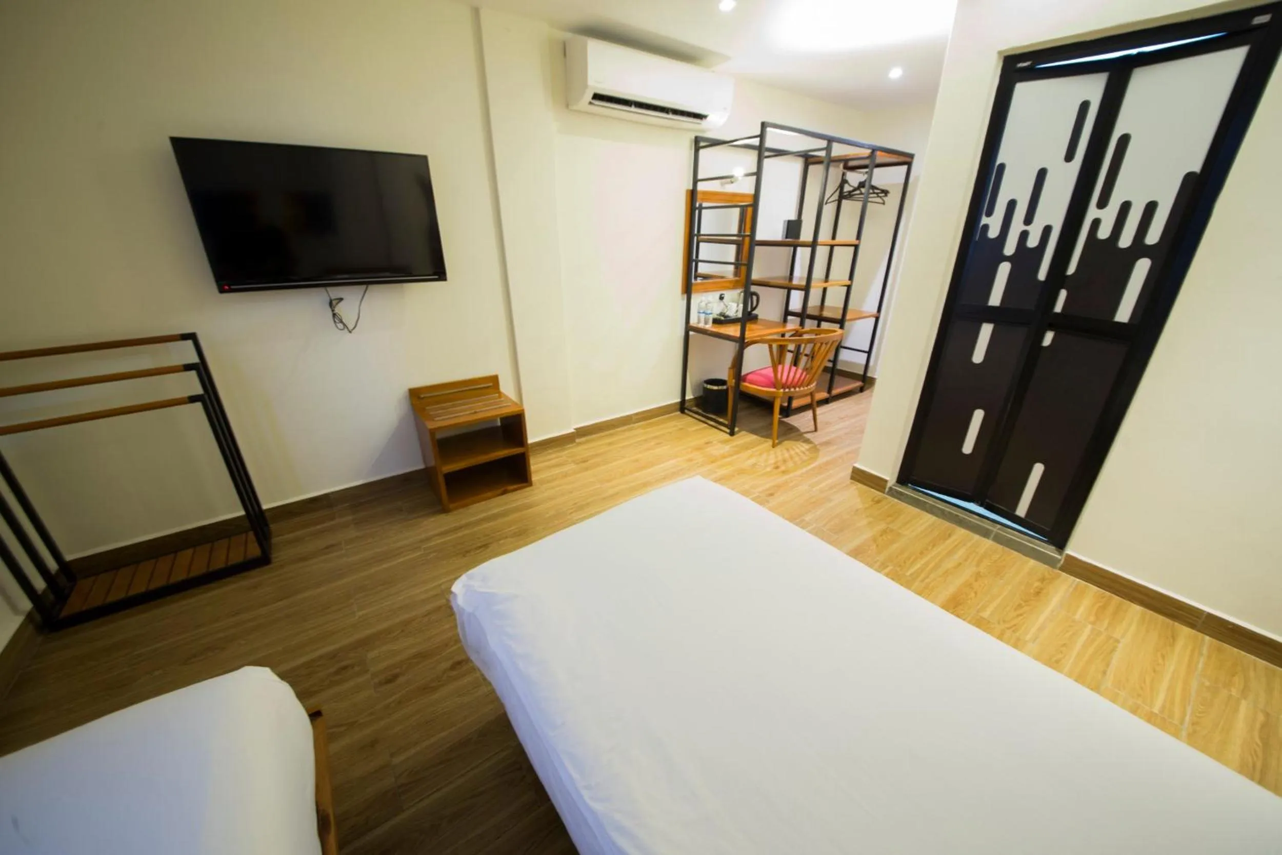 Bed in The Point Boutique Hotel