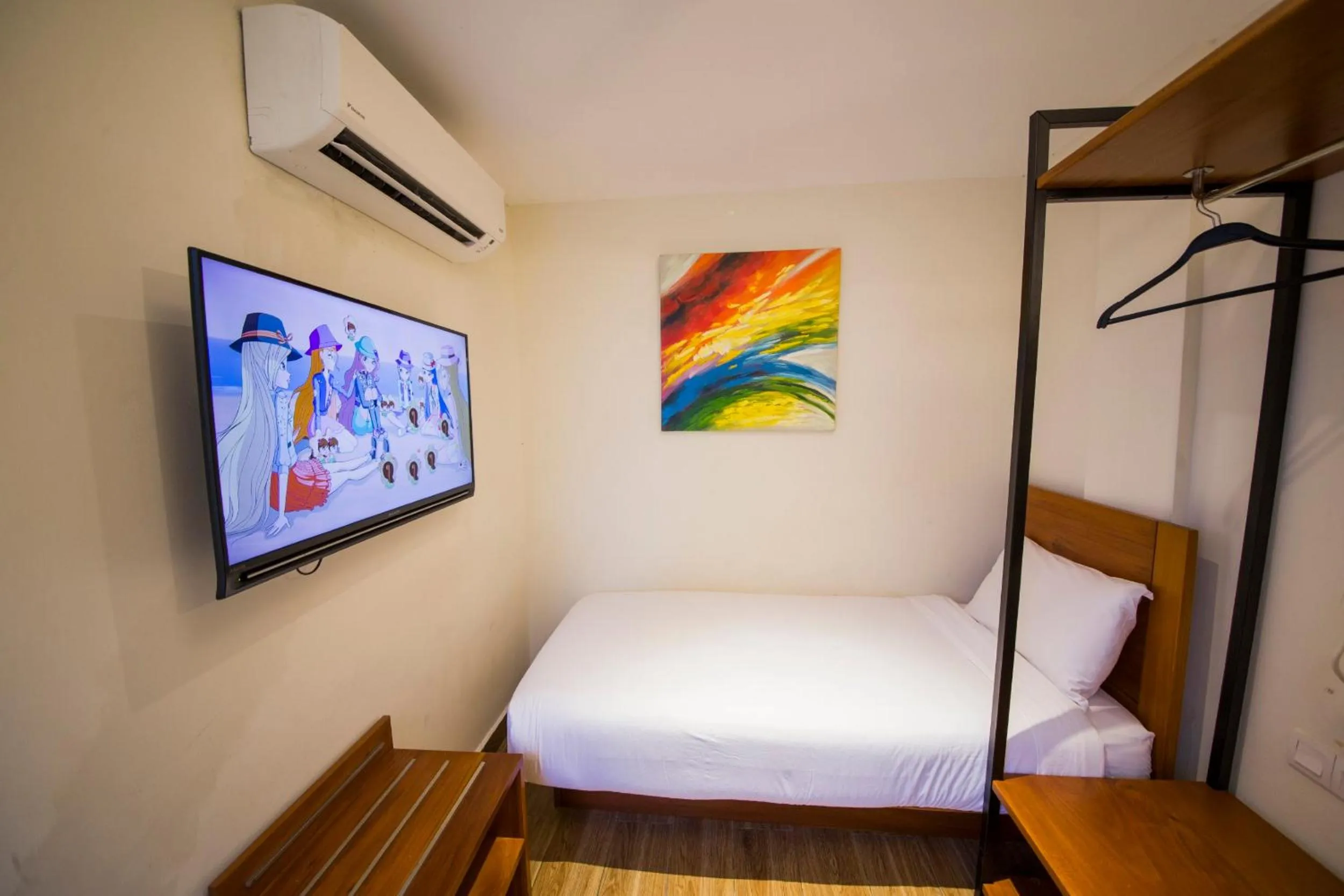 Bed in The Point Boutique Hotel