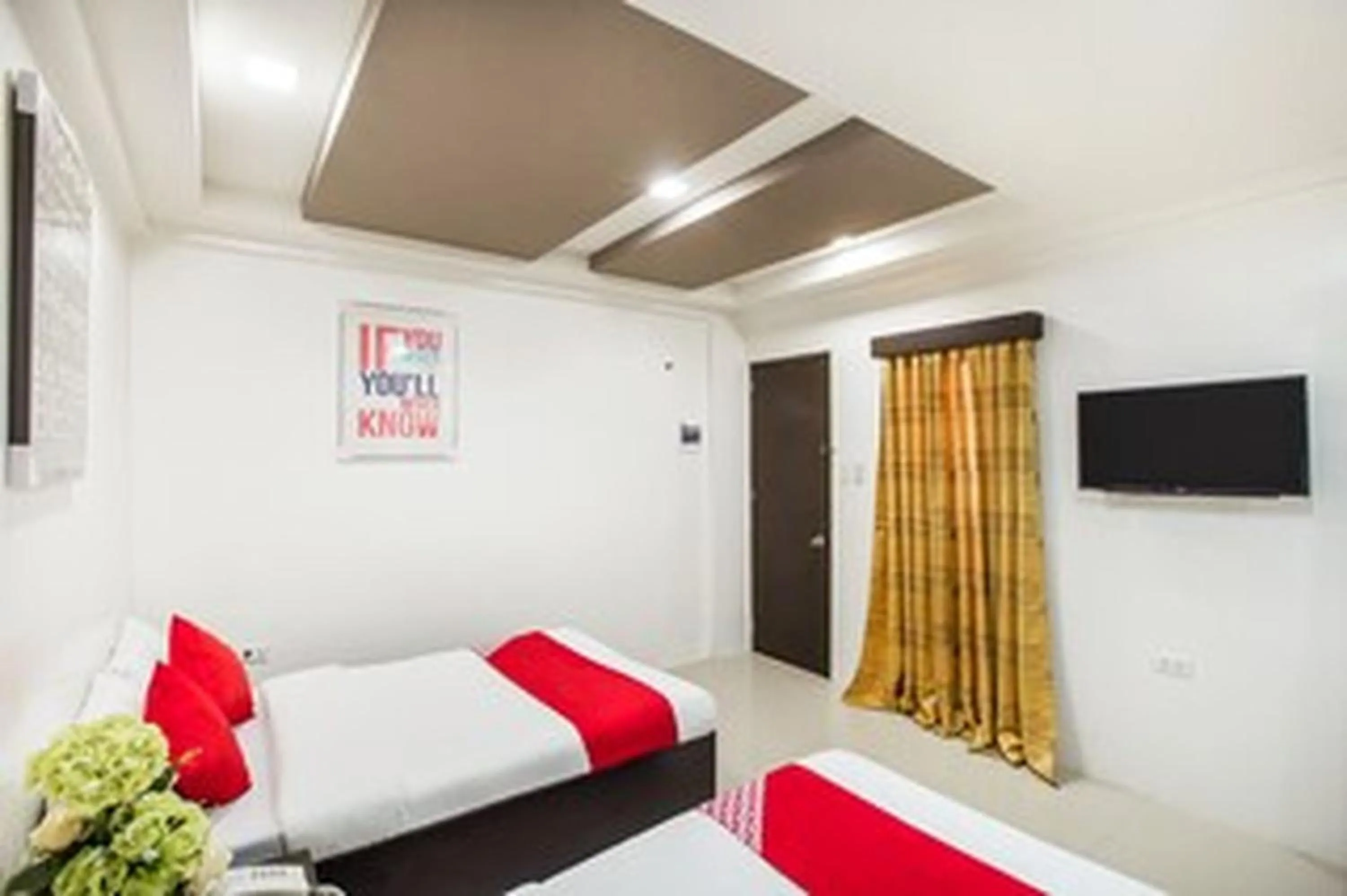 Bed in OYO 489 Casa Mia Hotel Suites