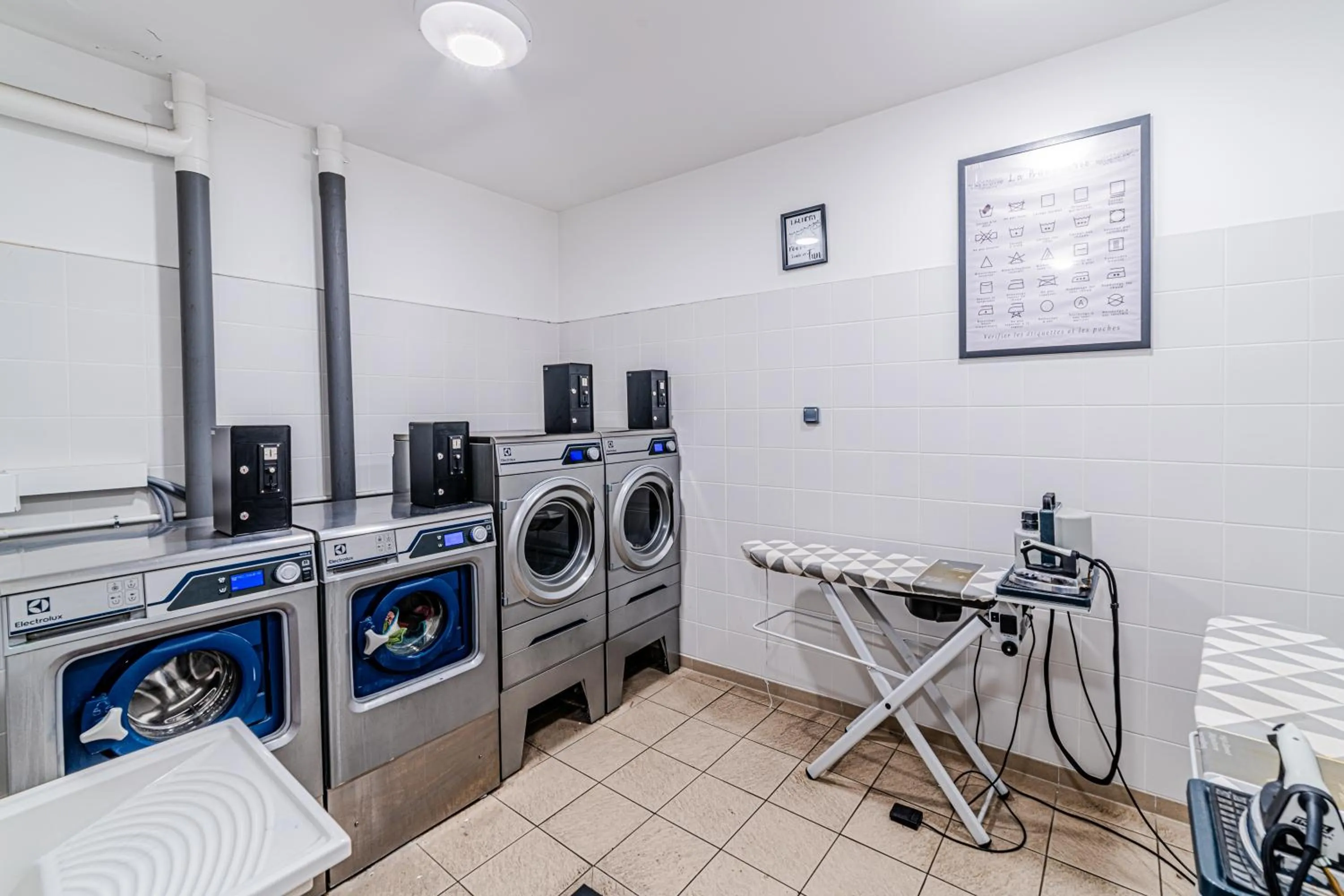 washing machine in Break & Home Paris Italie Porte de Choisy Appart'Hôtel