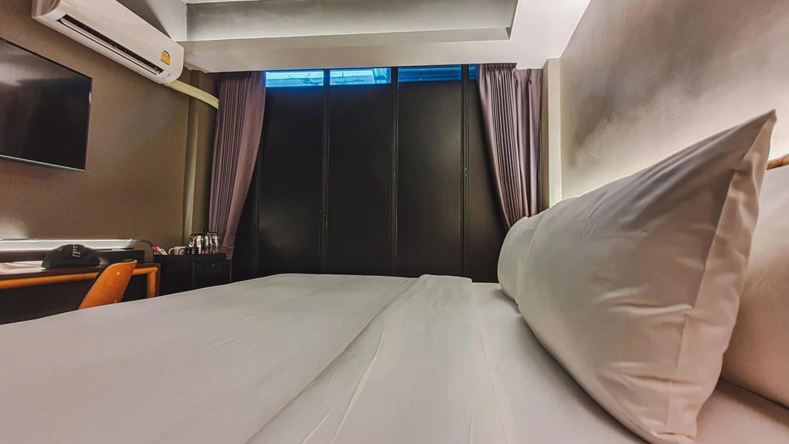 Bed in Hotel Ordinary Bangkok