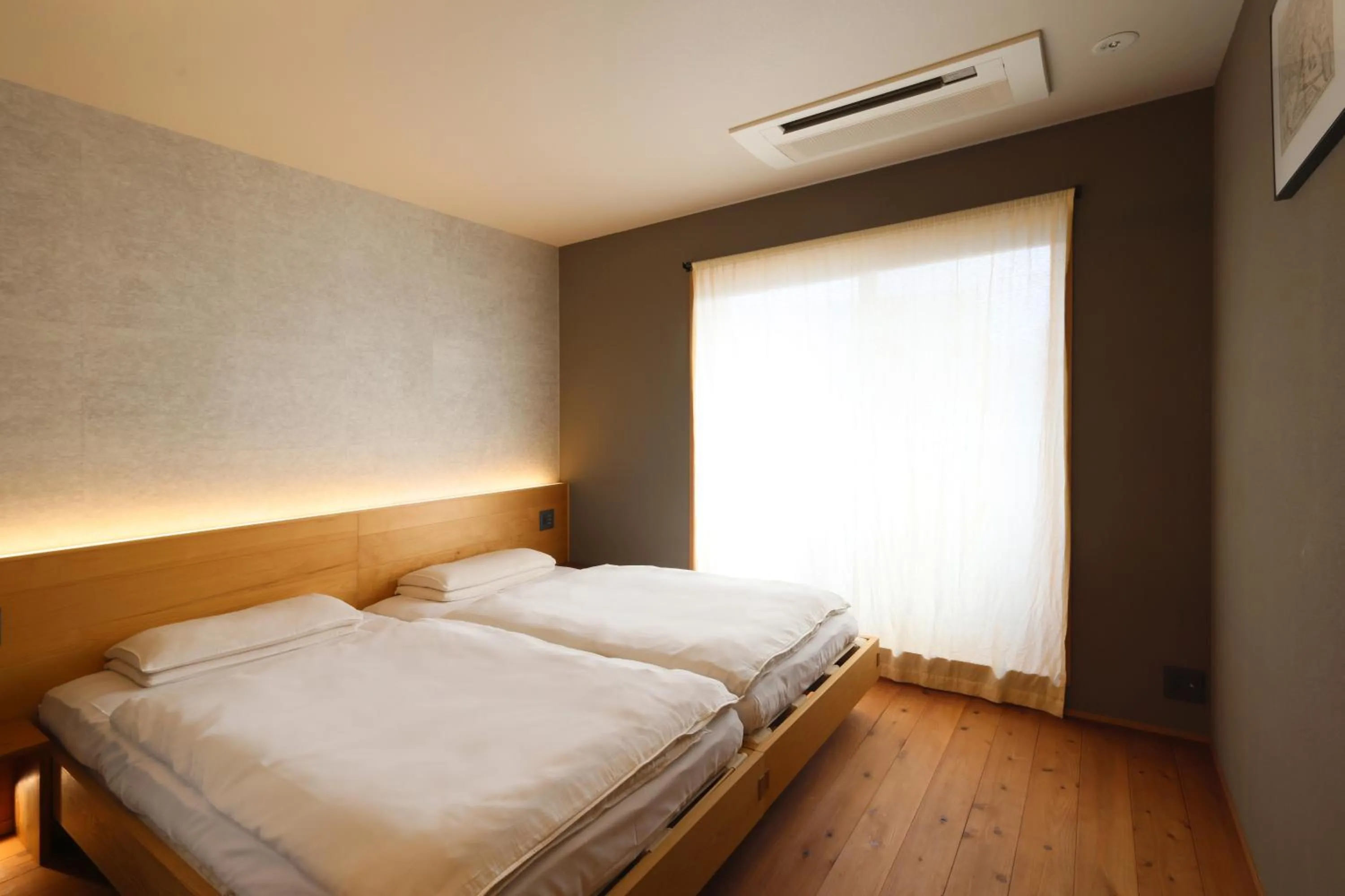 Bed in Neon Hotel - Luxury Sleep Retreat -