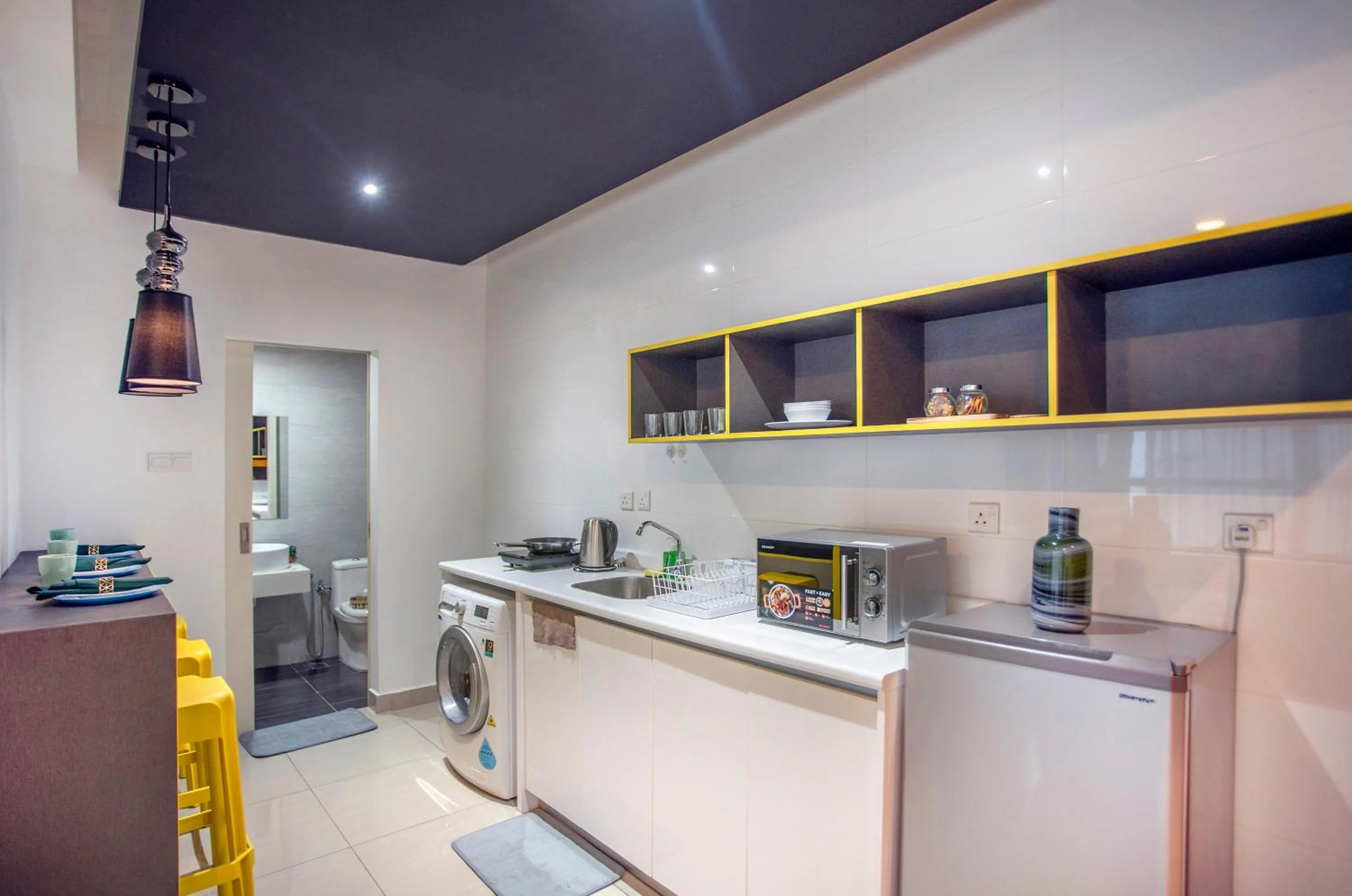Kitchen or kitchenette in Arte Plus KLCC Designer Suites by Cobnb