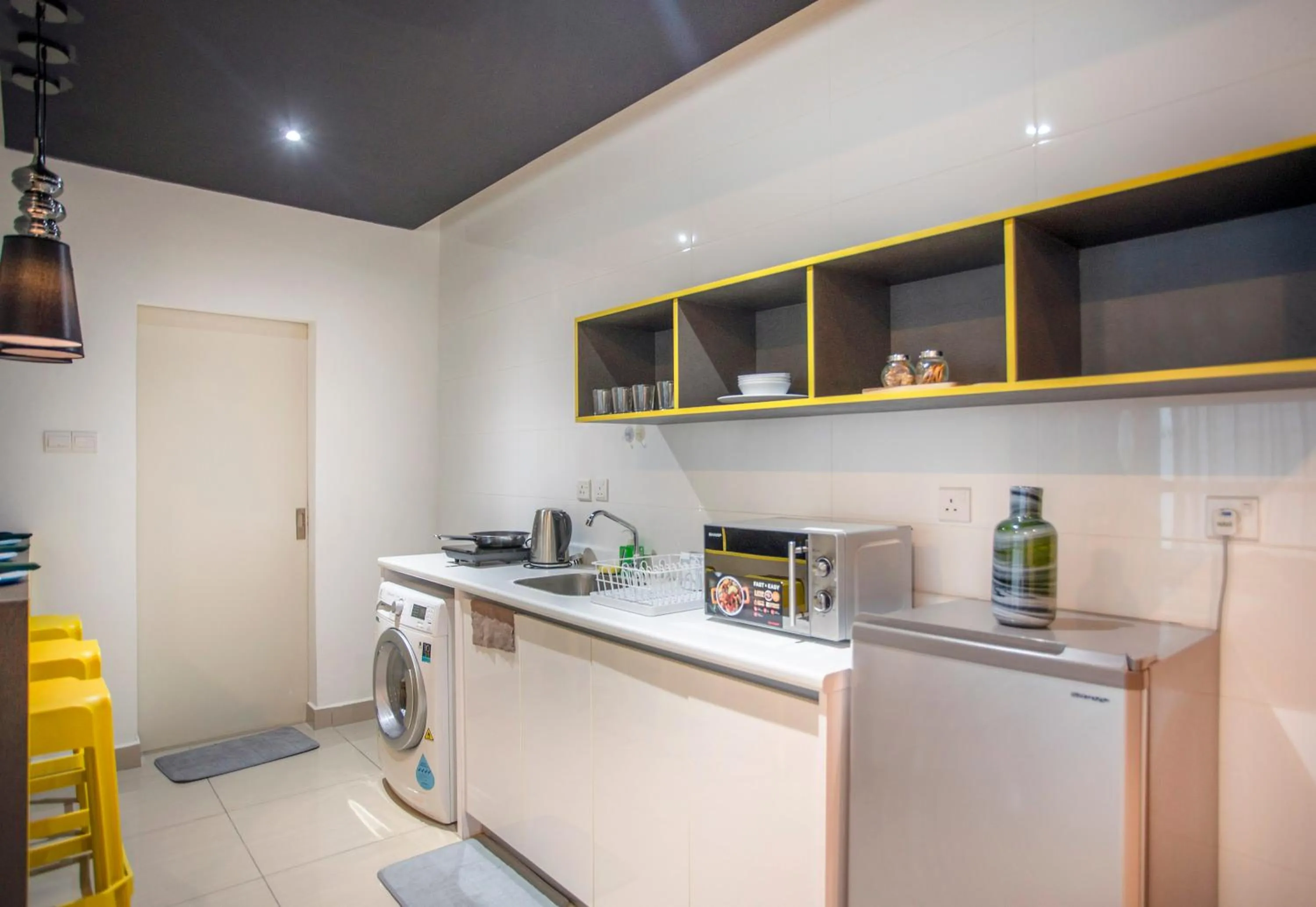 Kitchen or kitchenette in Arte Plus KLCC Designer Suites by Cobnb