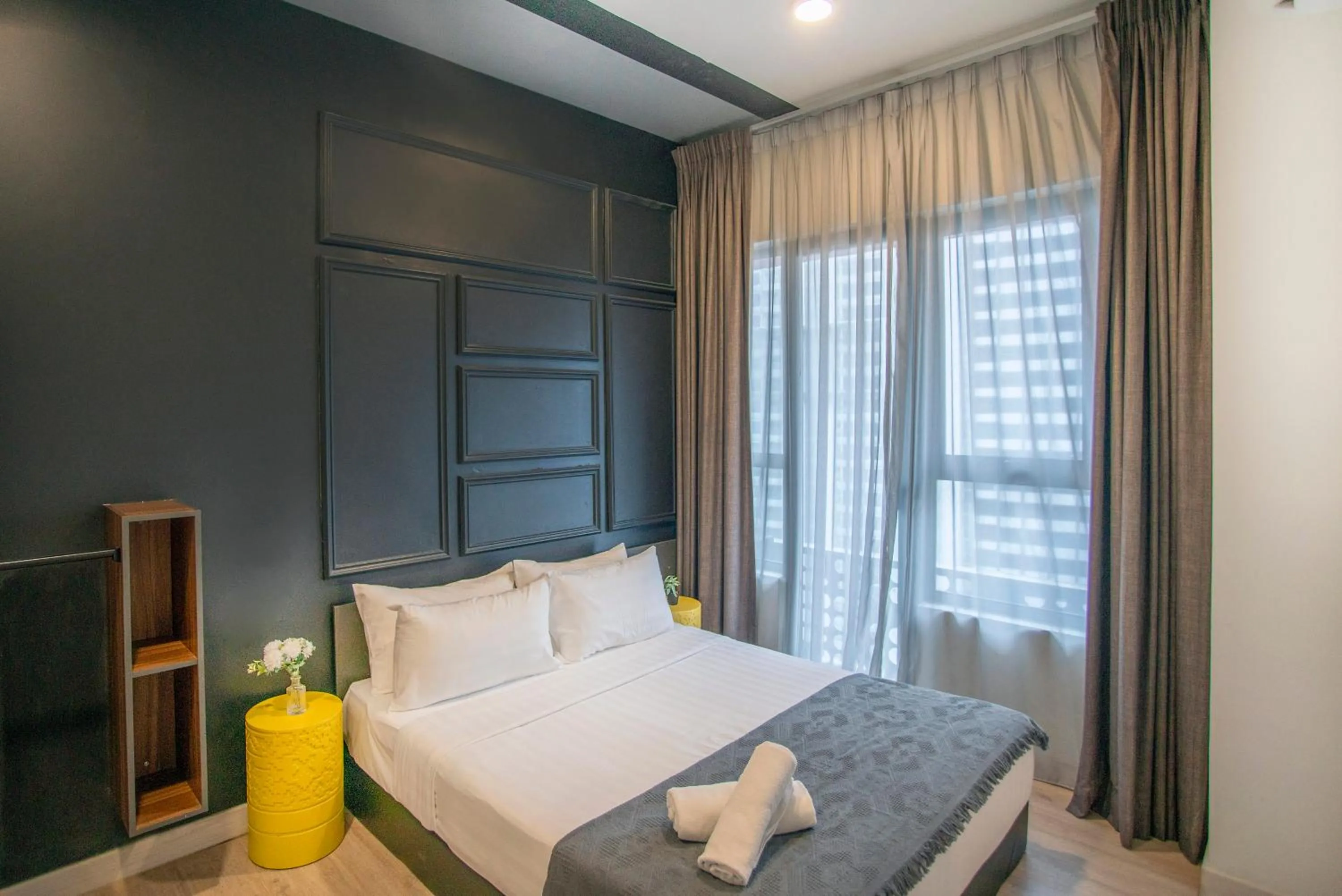Bed in Arte Plus KLCC Designer Suites by Cobnb