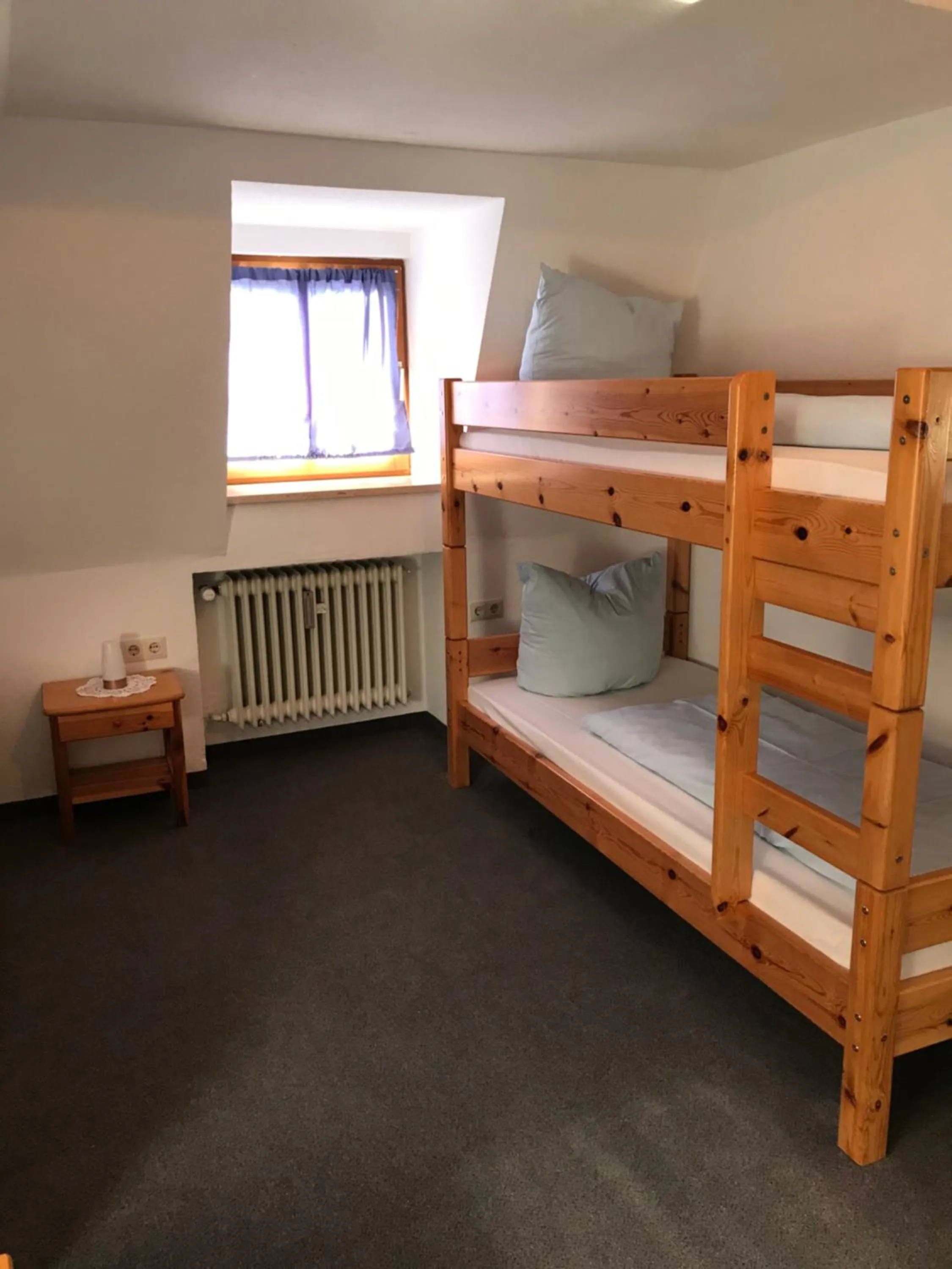 Bed in Hotel Guntia Boardinghouse virtueller check in und Zimmer Zugang