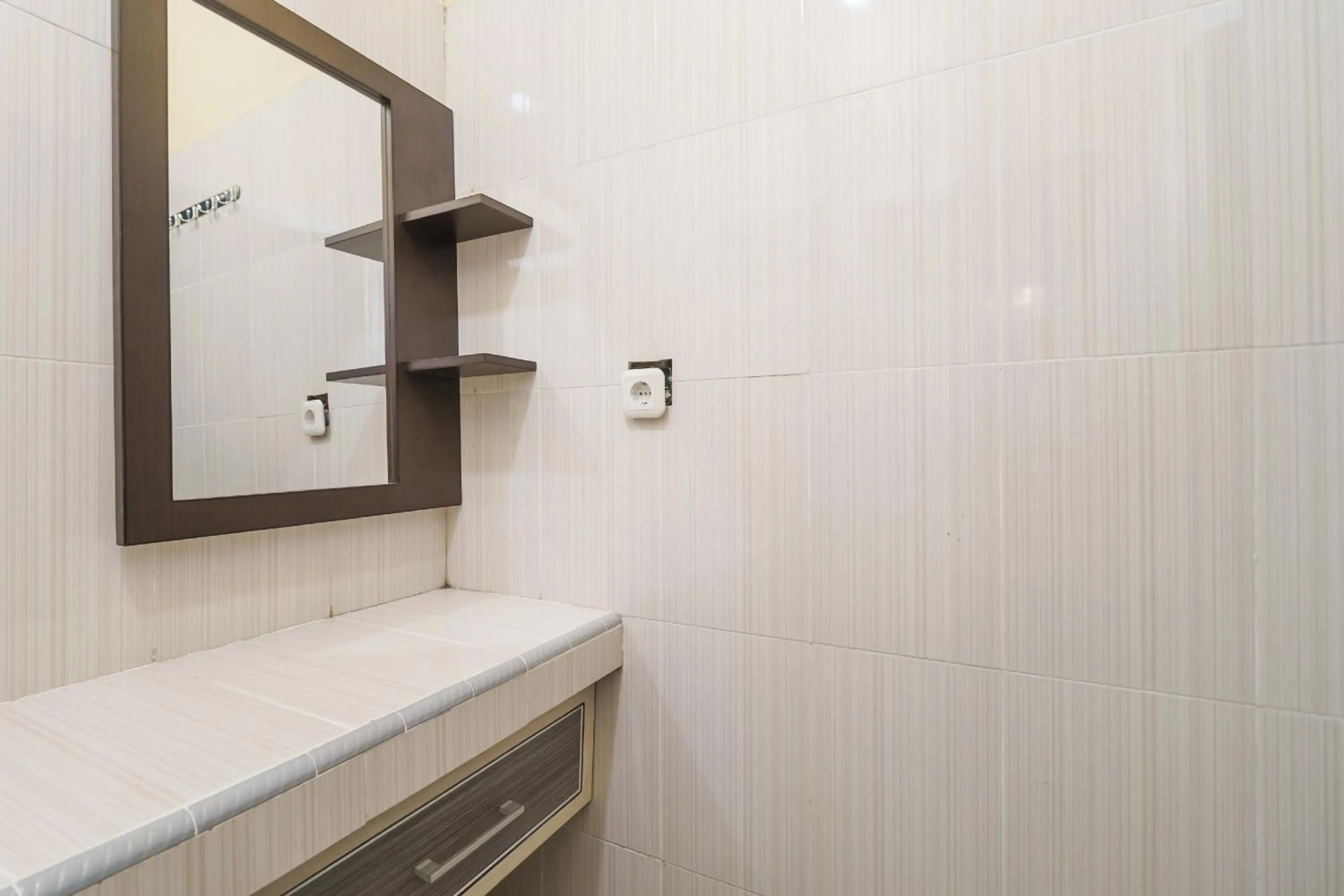 Bathroom in RedDoorz Syariah @ Mora Garden Bungo