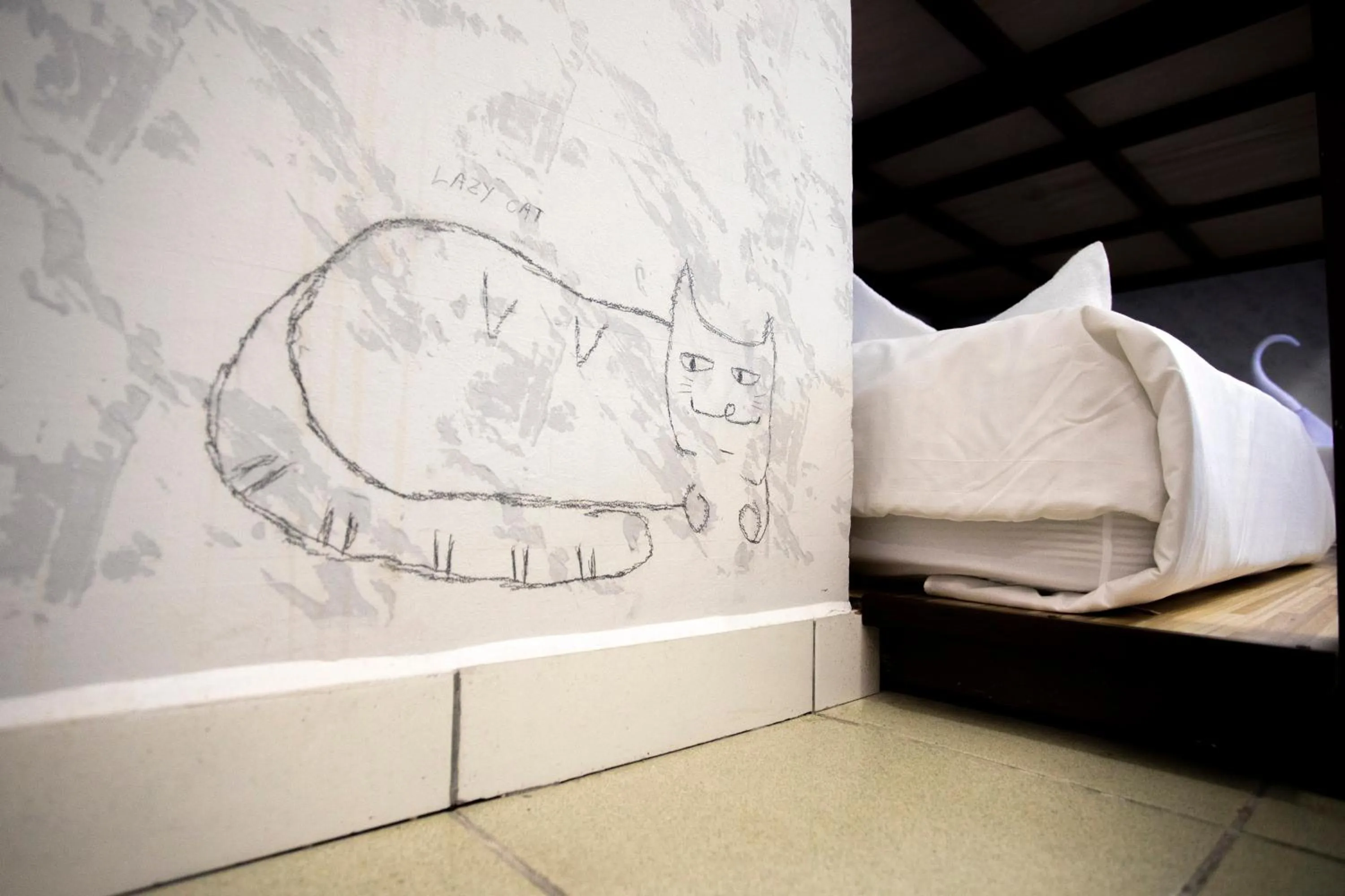 Bed in Lazy Cat Home At Gaya Street