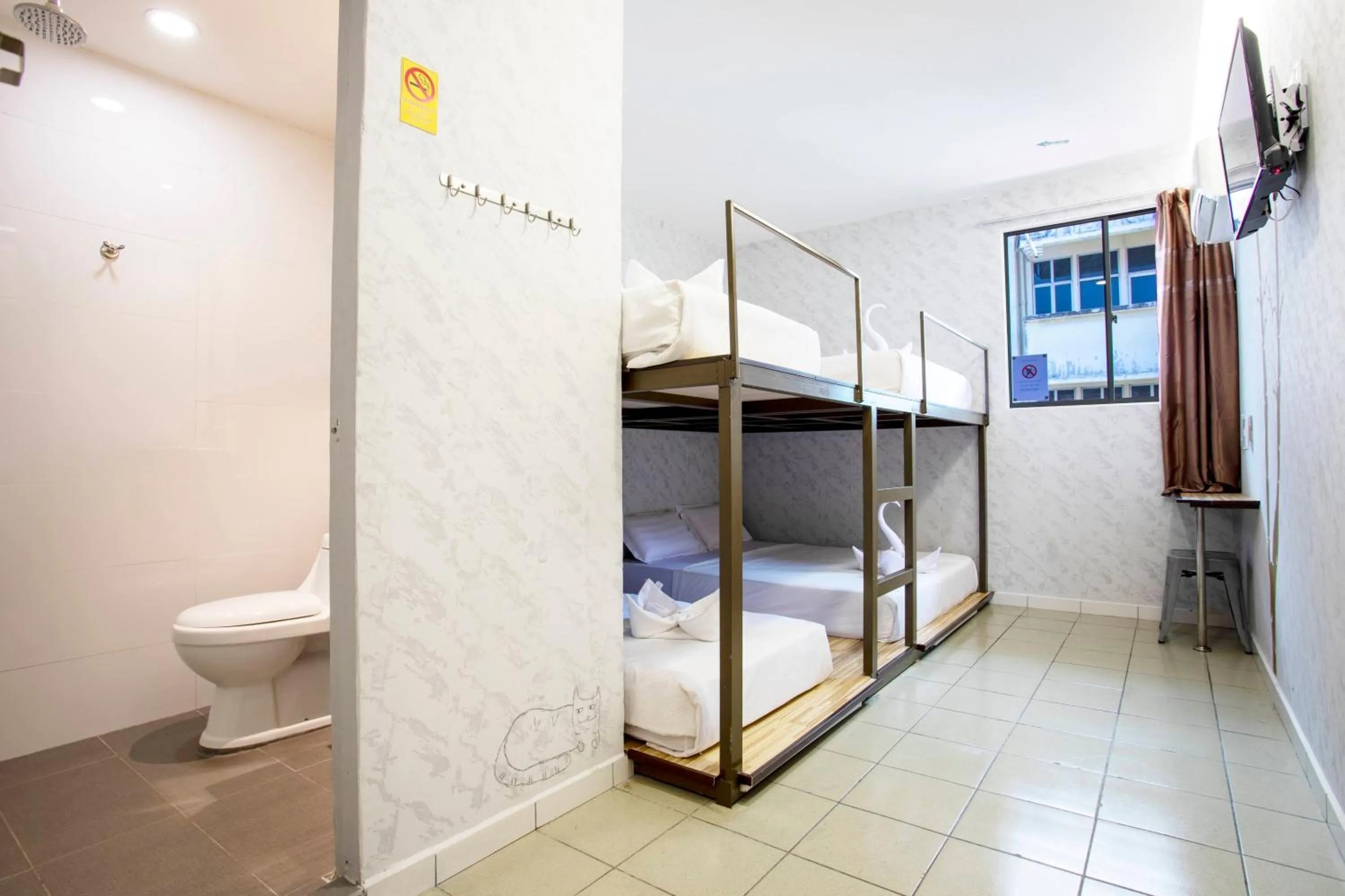 Bed in Lazy Cat Home At Gaya Street