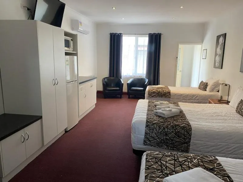 Bed in The Esplanade Motel