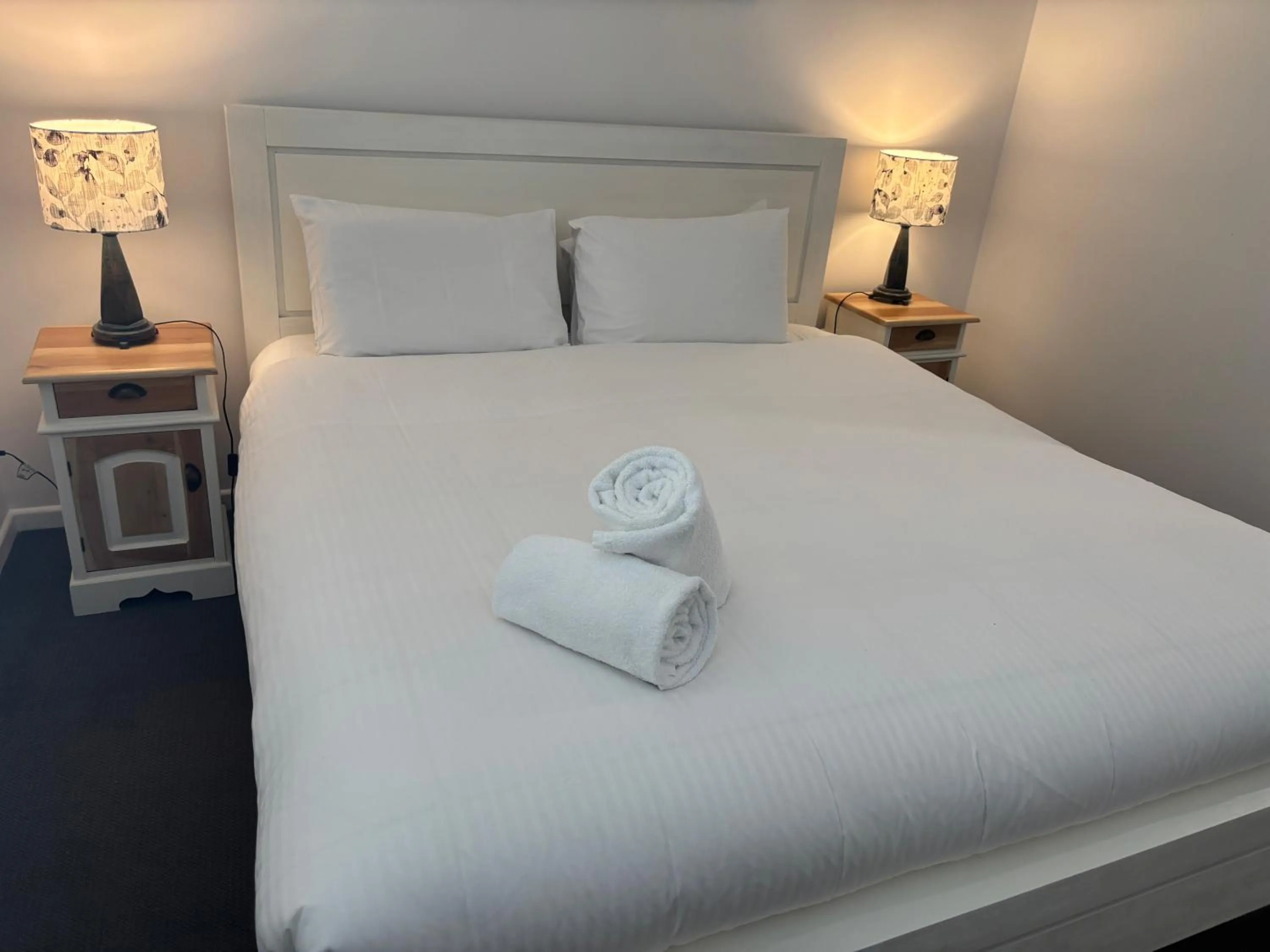 Bed in Aqua Promenade Beachfront Holiday Apartments