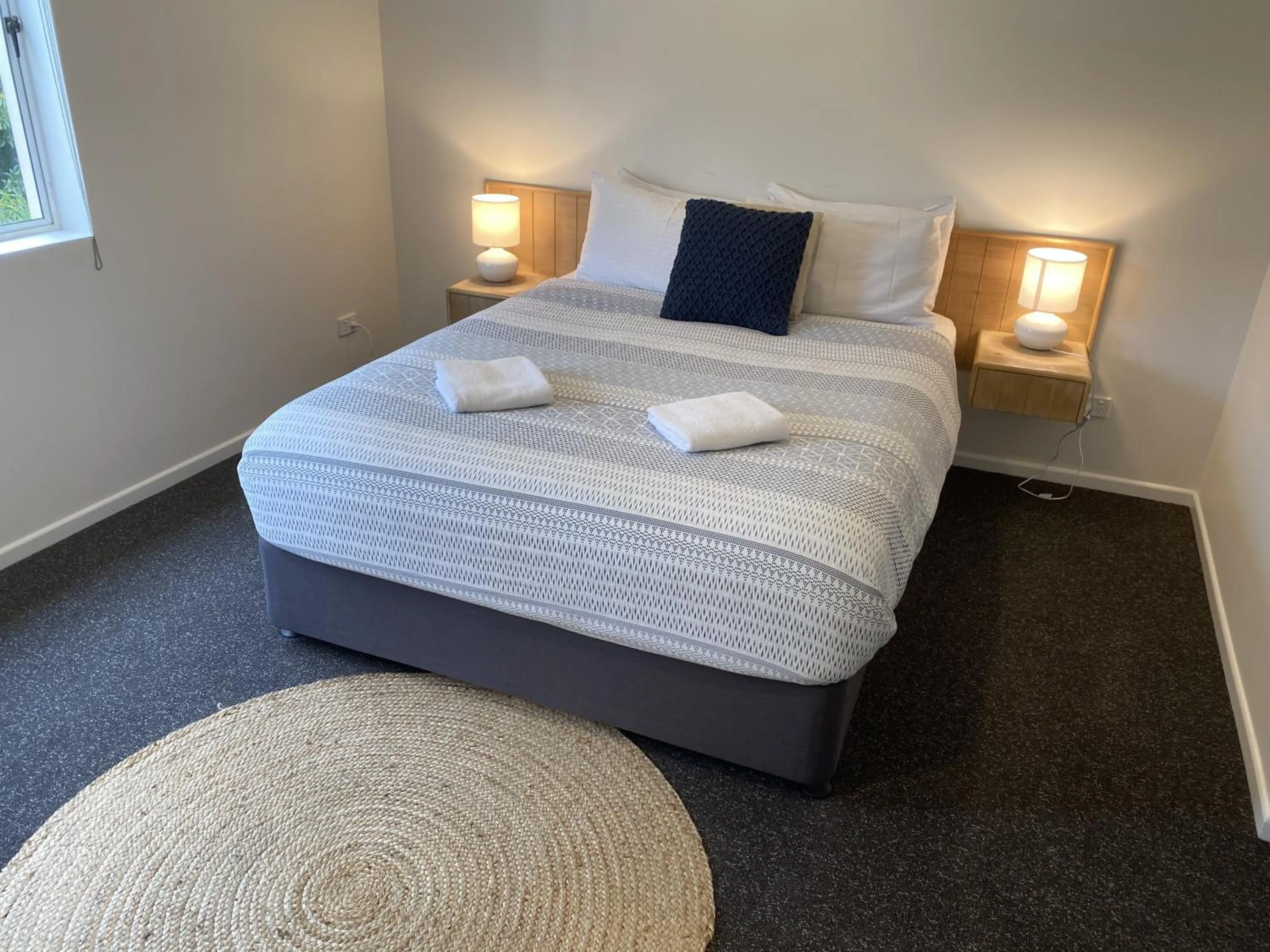 Bed in Aqua Promenade Beachfront Holiday Apartments