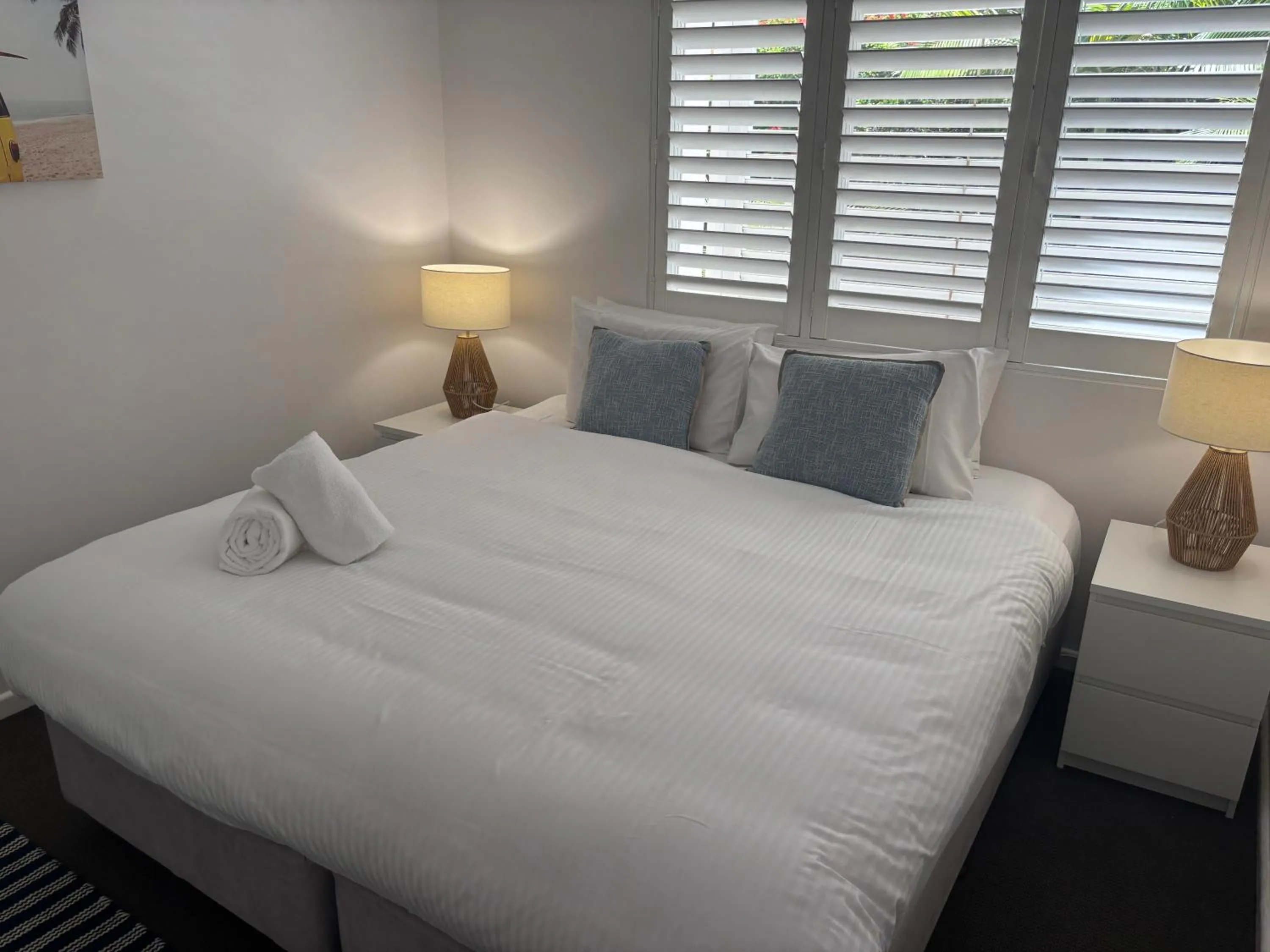 Bed in Aqua Promenade Beachfront Holiday Apartments