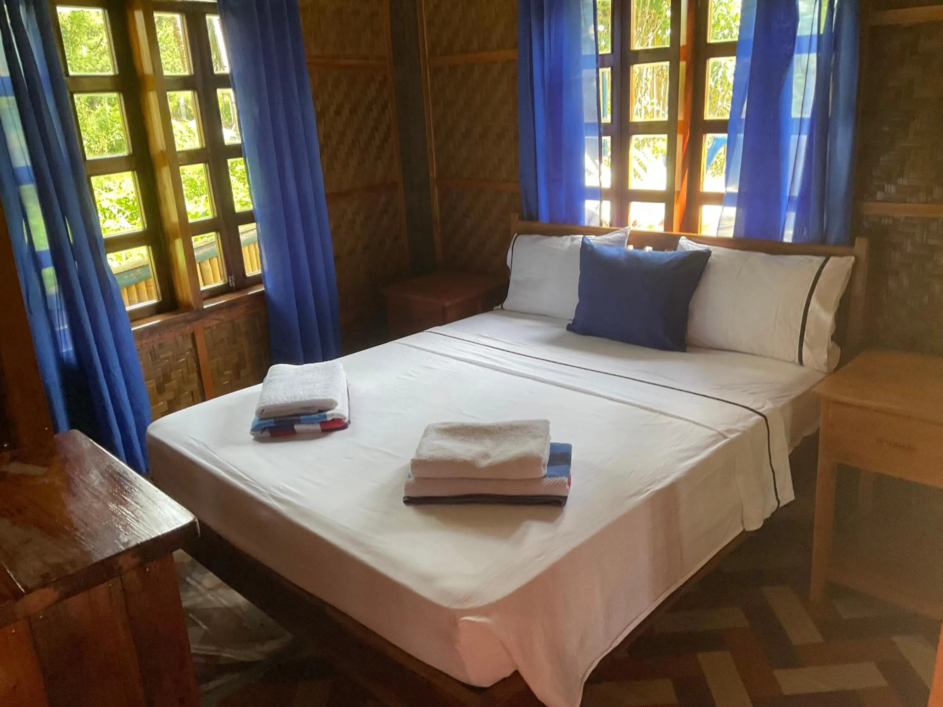 Bed in Rainbow Bay Beach & Dive Resort