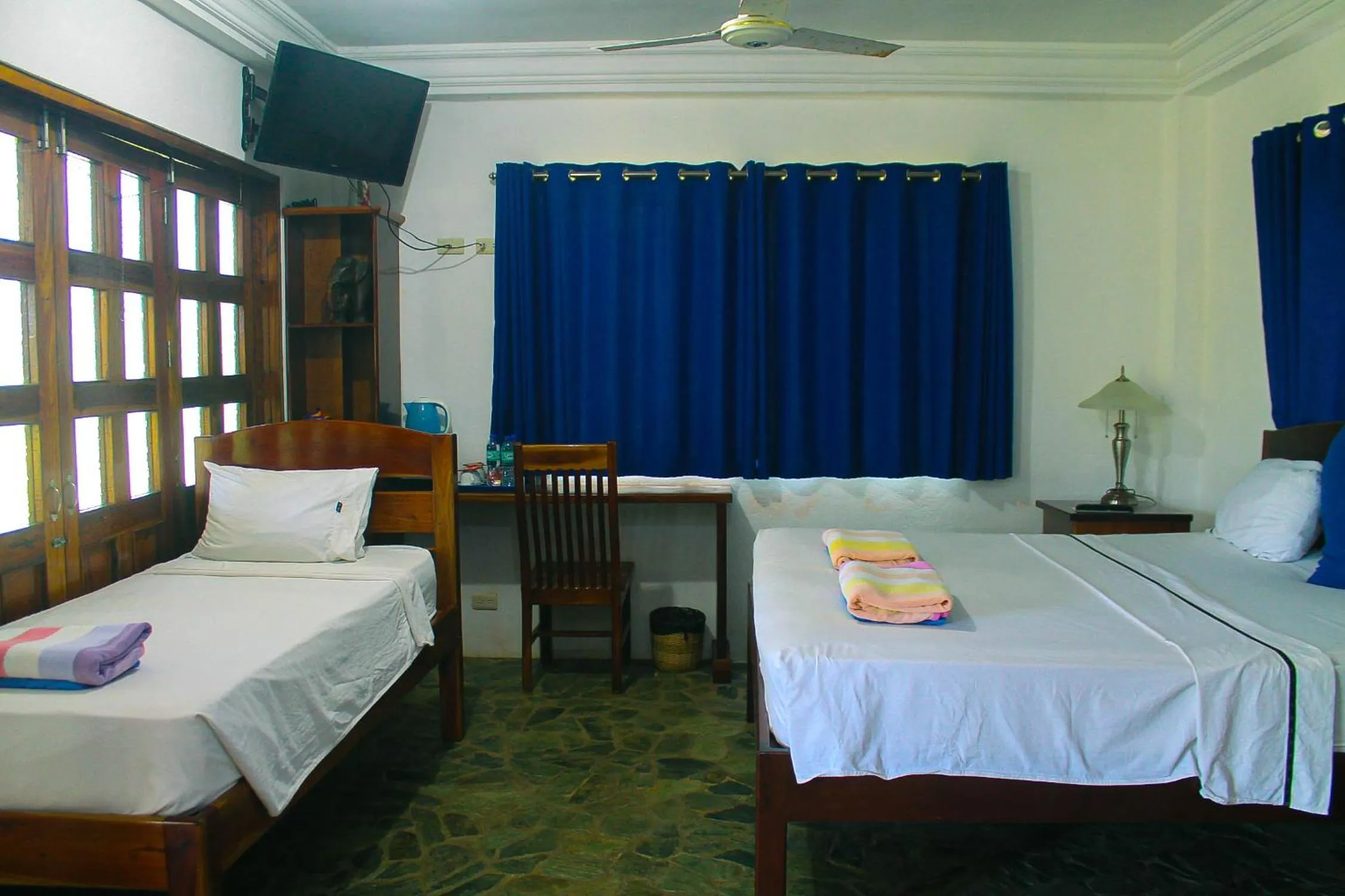 Bed in Rainbow Bay Beach & Dive Resort