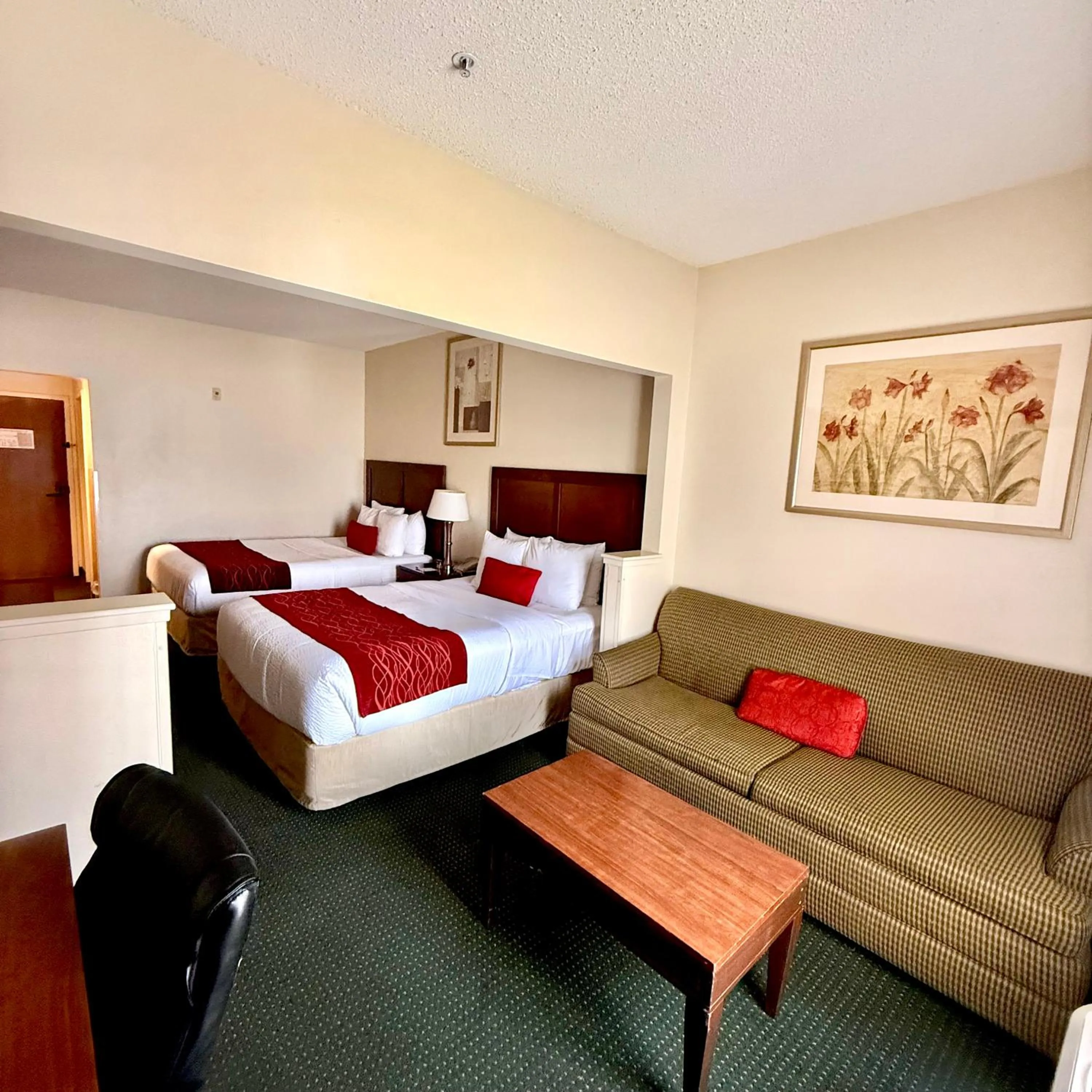 Seating area, Bed in Ramada by Wyndham Denver International Airport