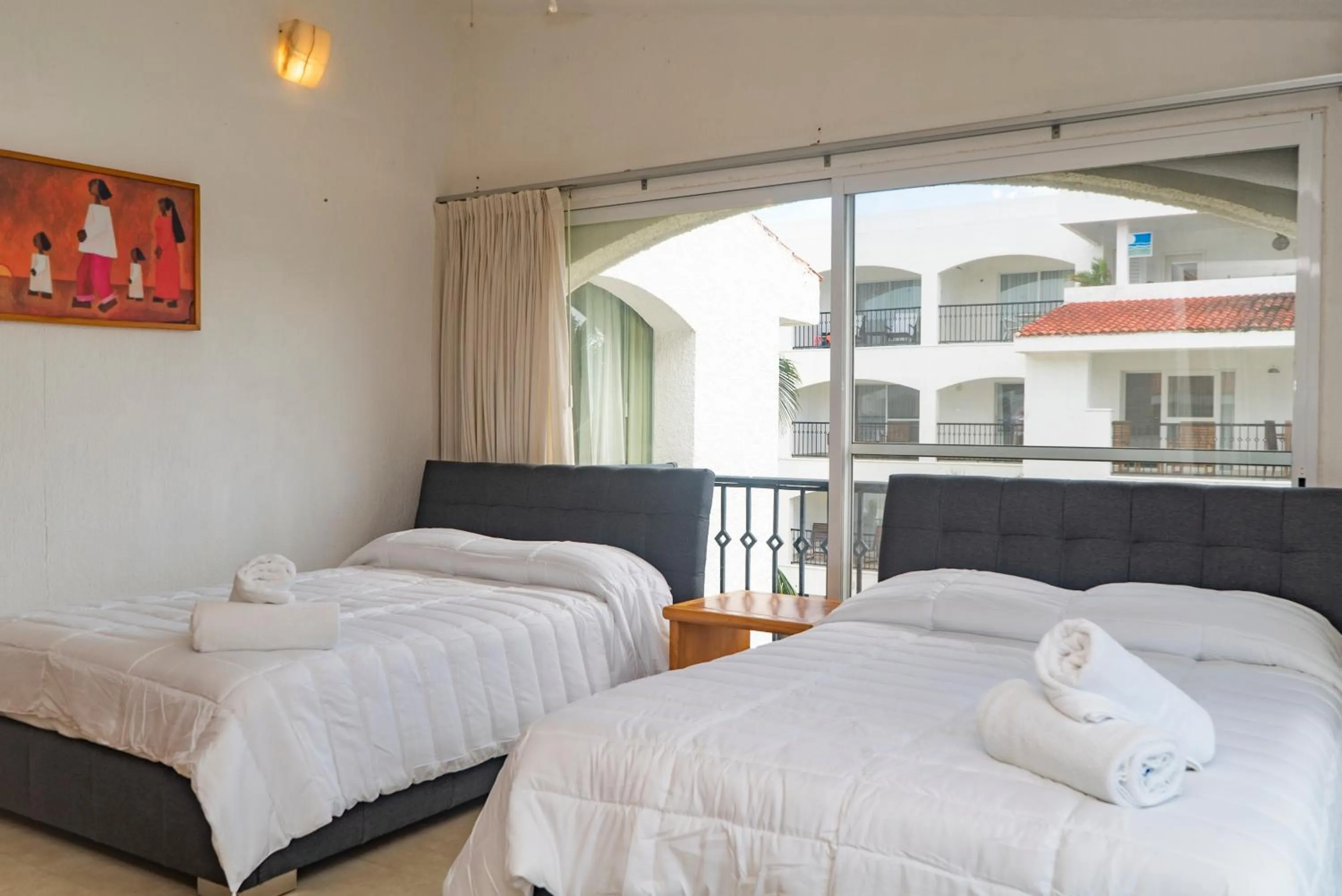 Bedroom, Bed in Oceanfront condo at voted best Cancun sandy beach