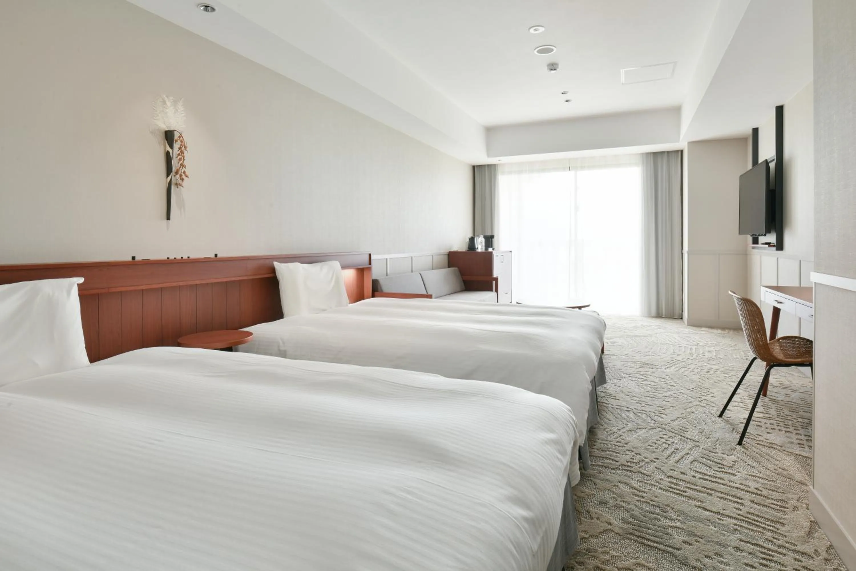 Bed in Lequ Okinawa Chatan Spa ＆ Resort