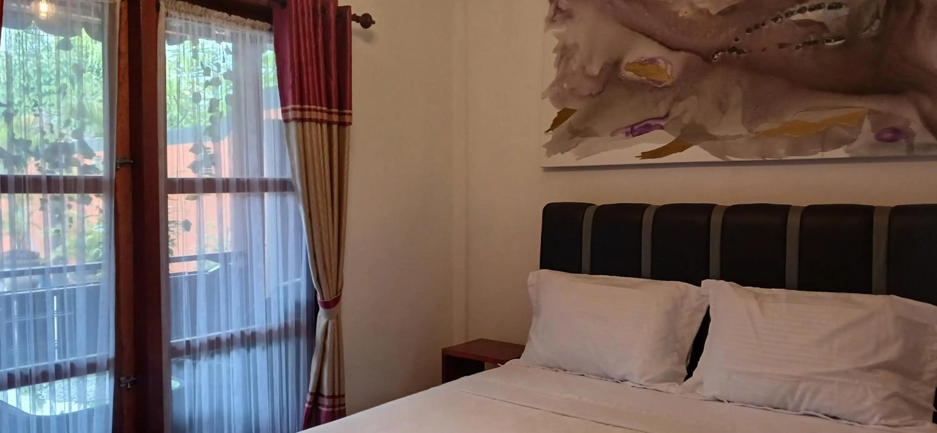 View (from property/room), Bed in Dewi Sri Guesthouse