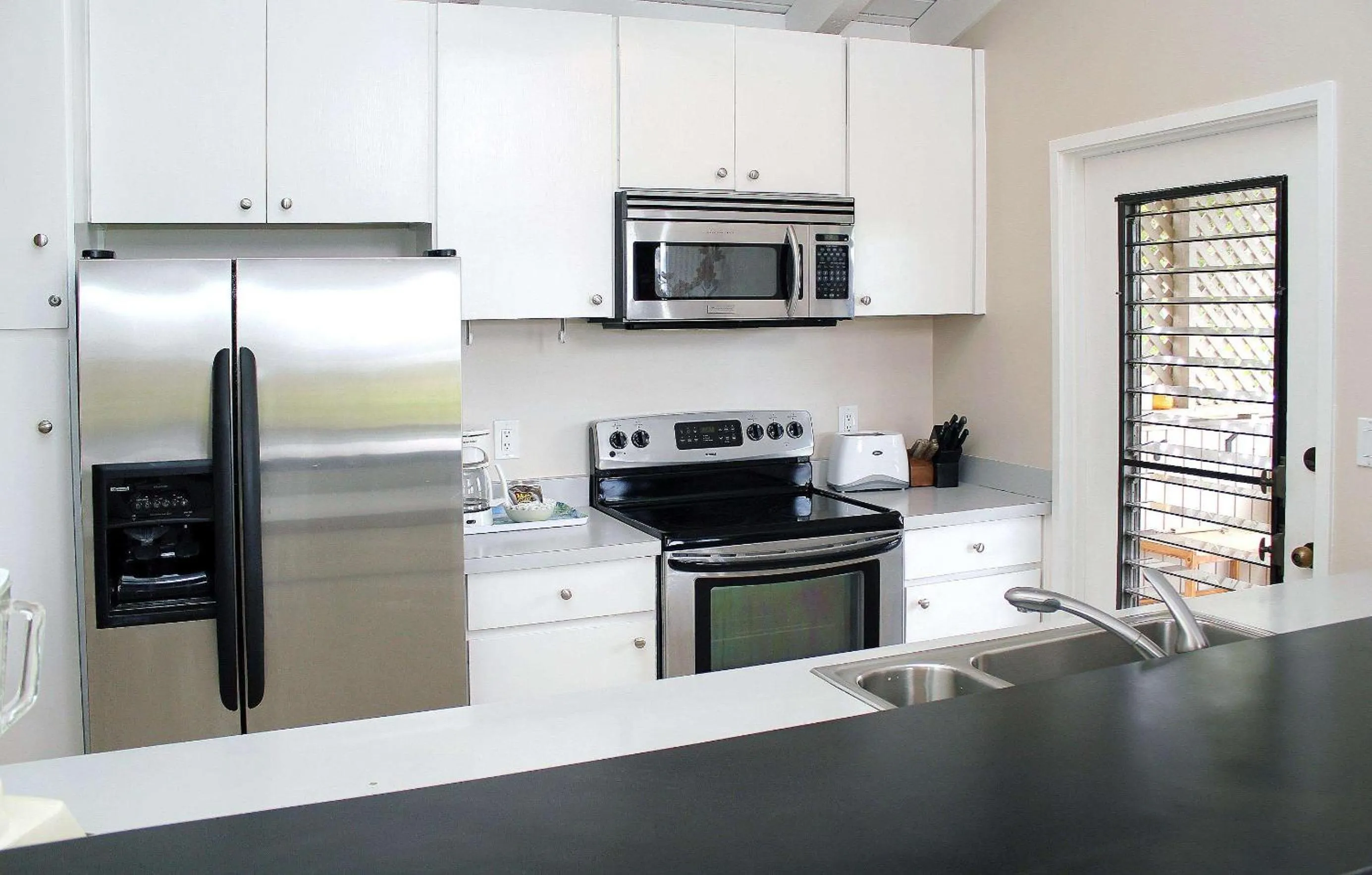 Photo of the whole room, Kitchen/Kitchenette in Wailea Ekolu Village - CoralTree Residence Collection