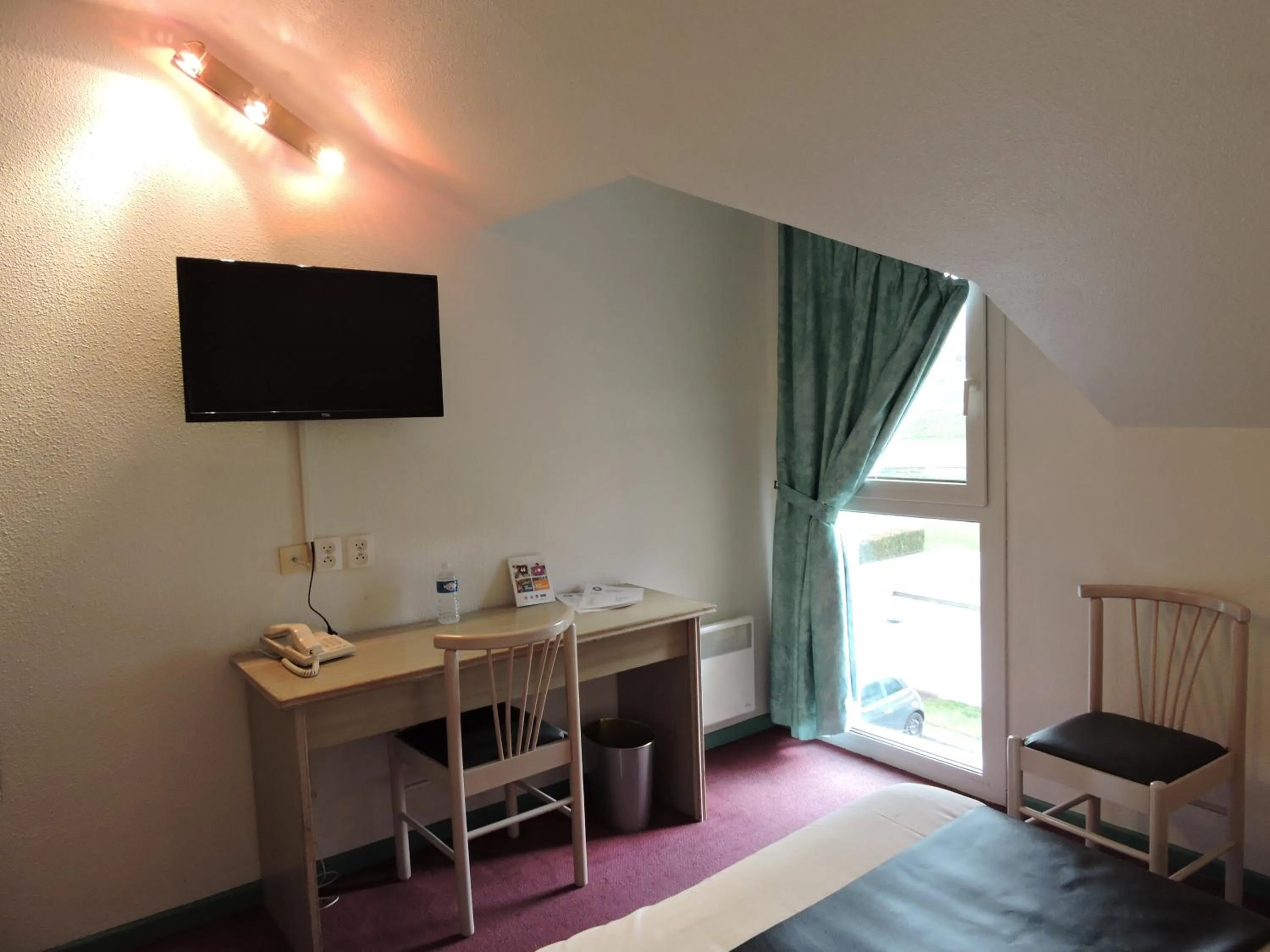 Bedroom in Hotel le Foron