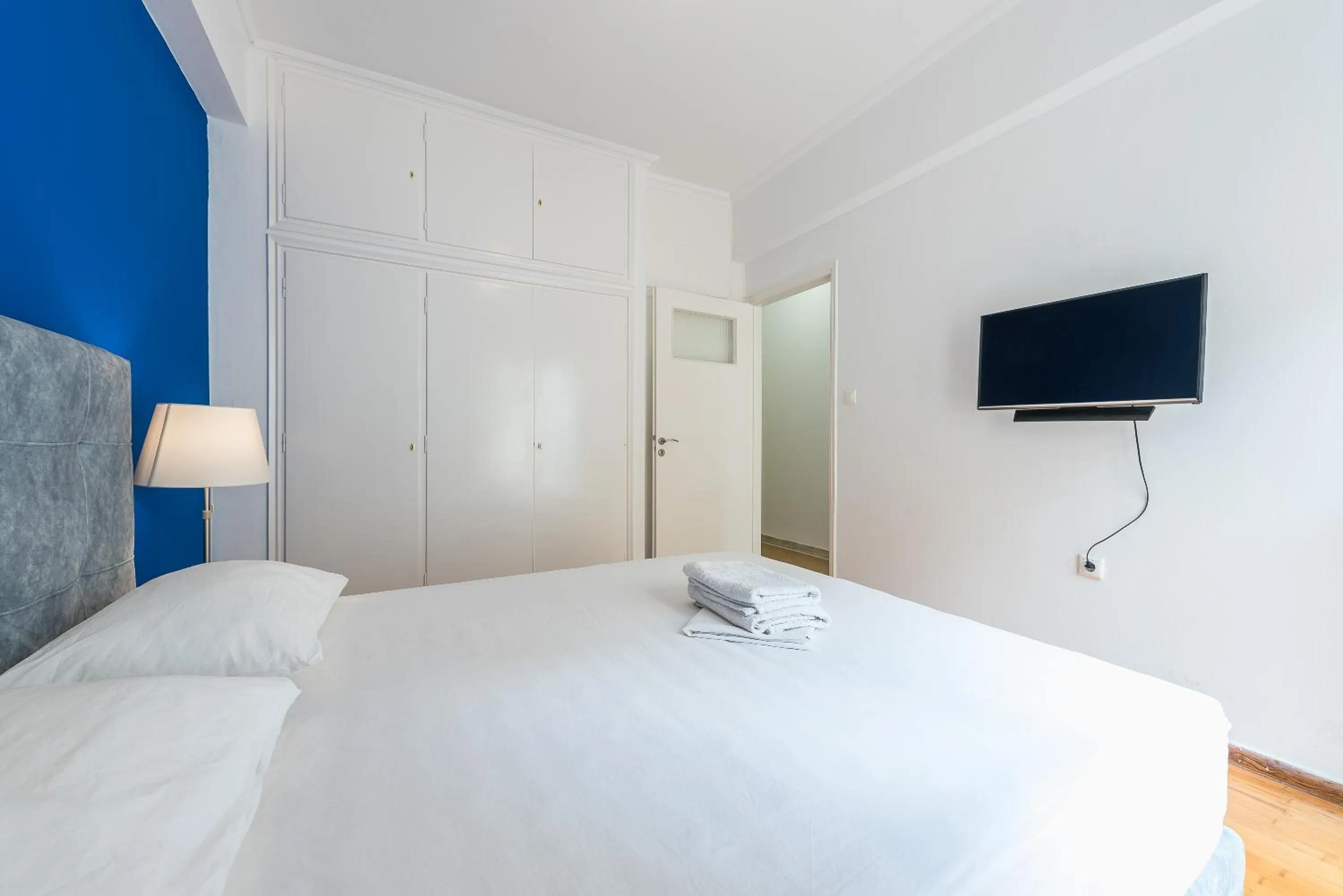 Bed in Victoria Queens Suites Apartments