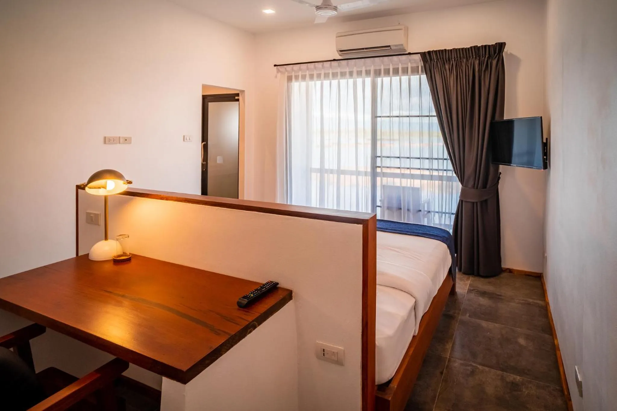 Bed in The Riviera Champasak