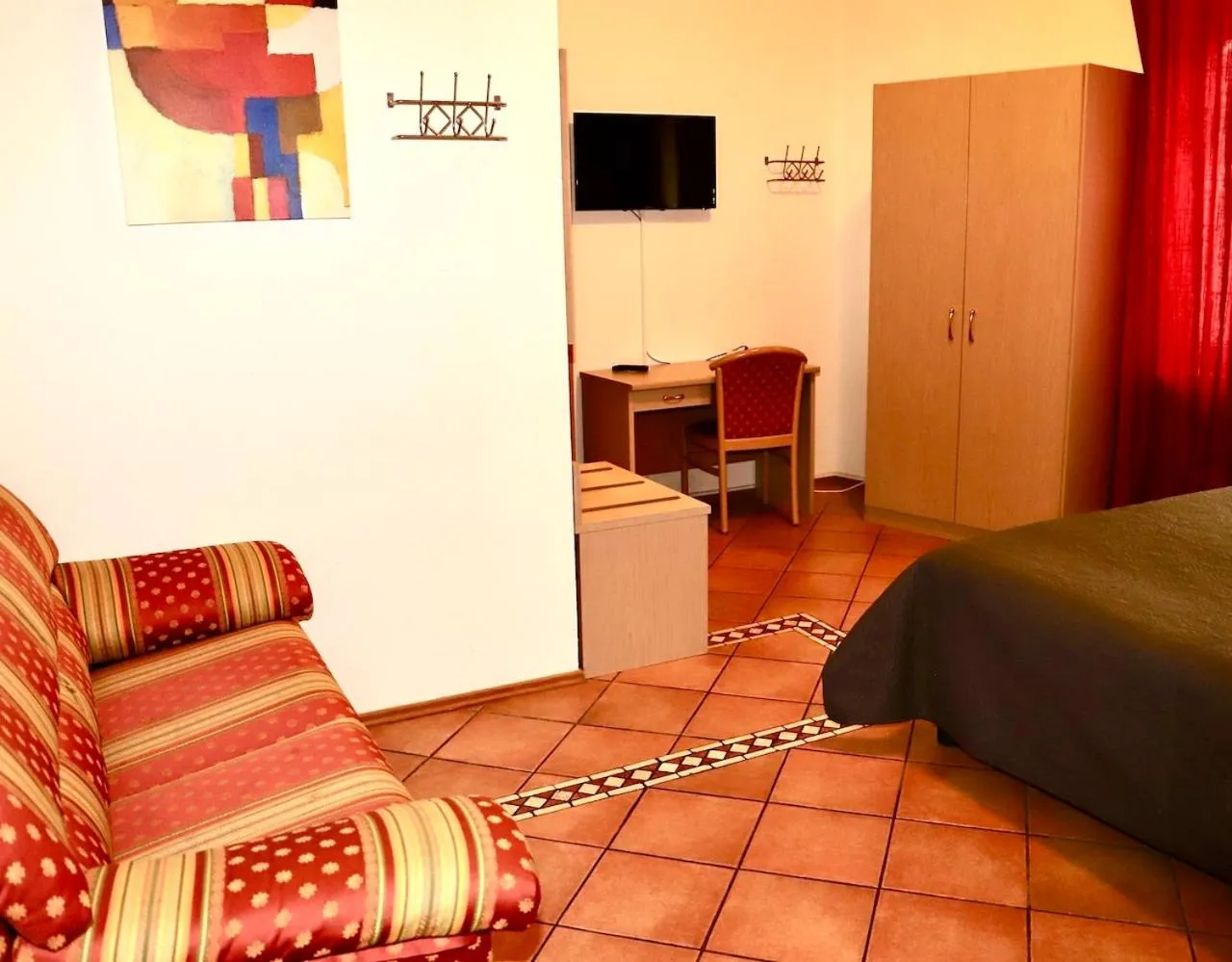 Seating area, Bed in Hotel Aurelia