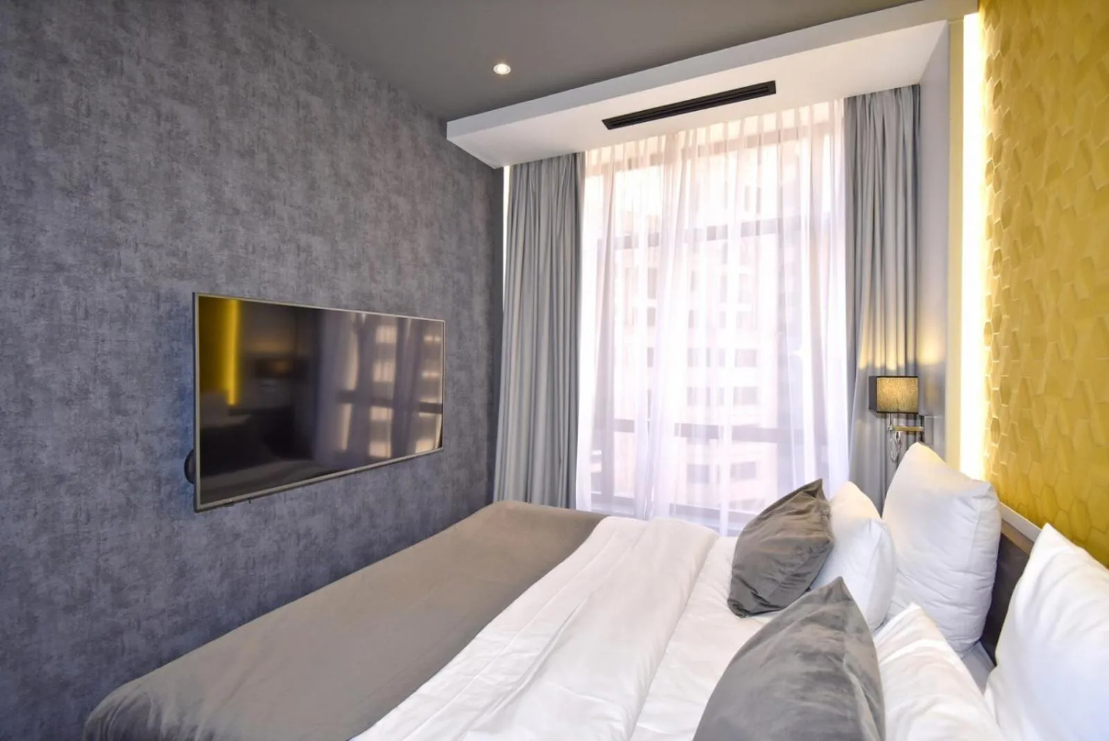 Bed in Avenue ApartHotel