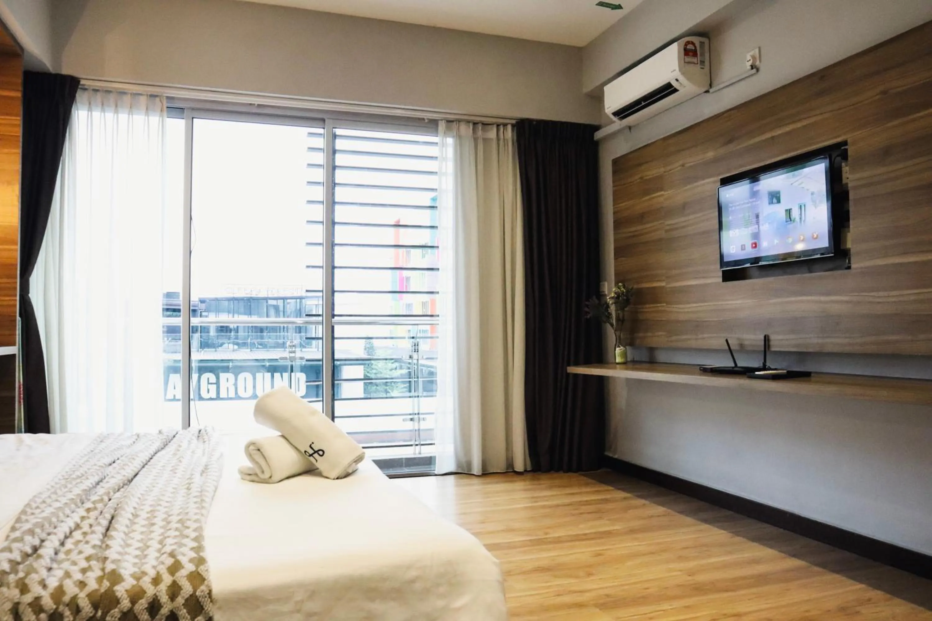 Bed in Homesuite' Home at Aeropod SOVO