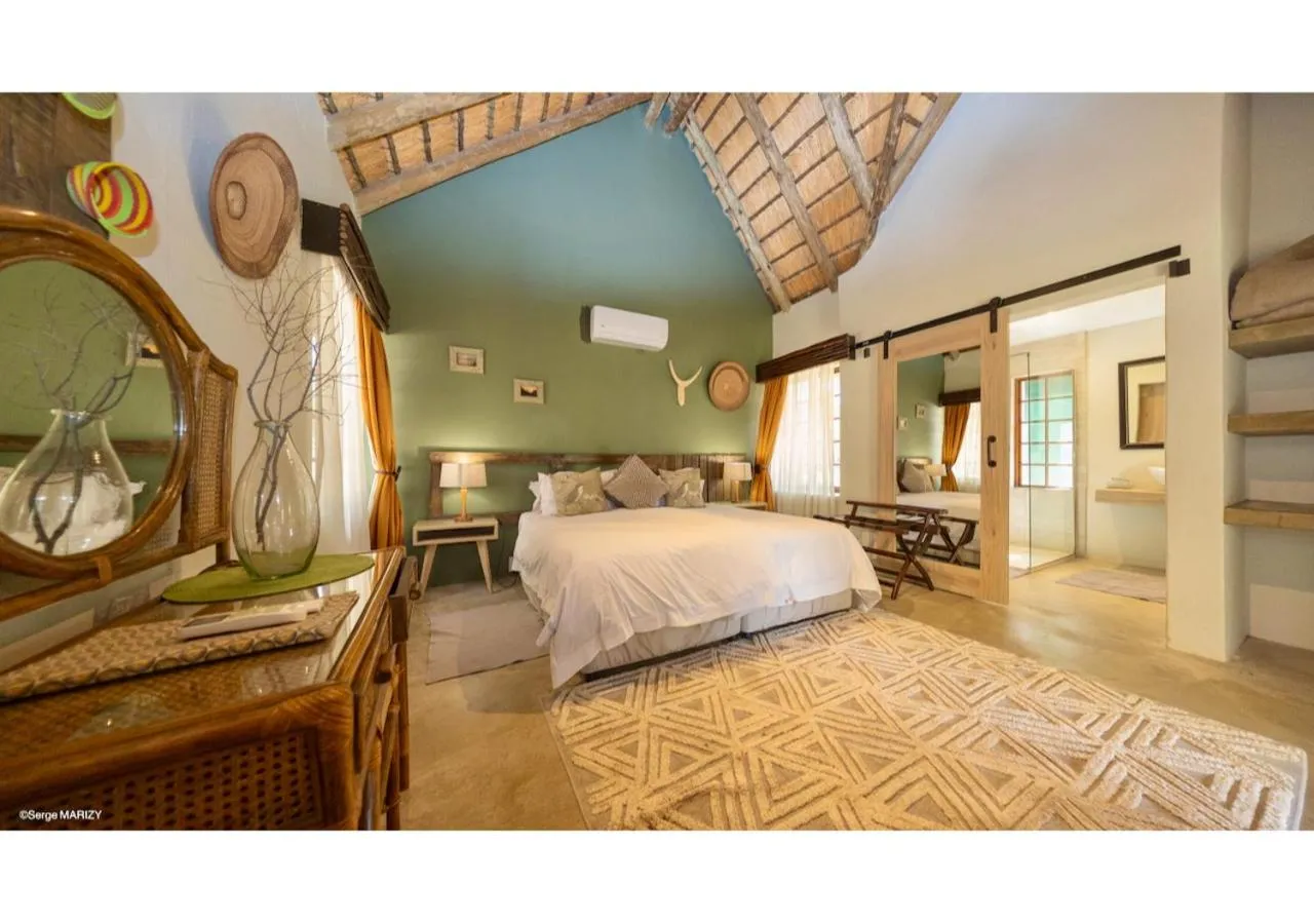 Bed in Mziki Safari Lodge