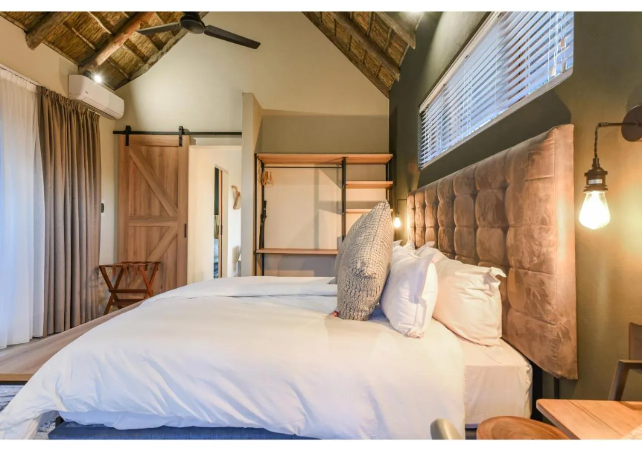 Bed in Mziki Safari Lodge