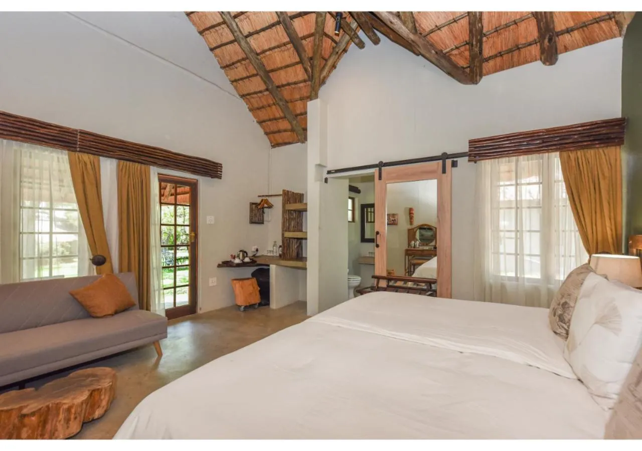 Bed in Mziki Safari Lodge
