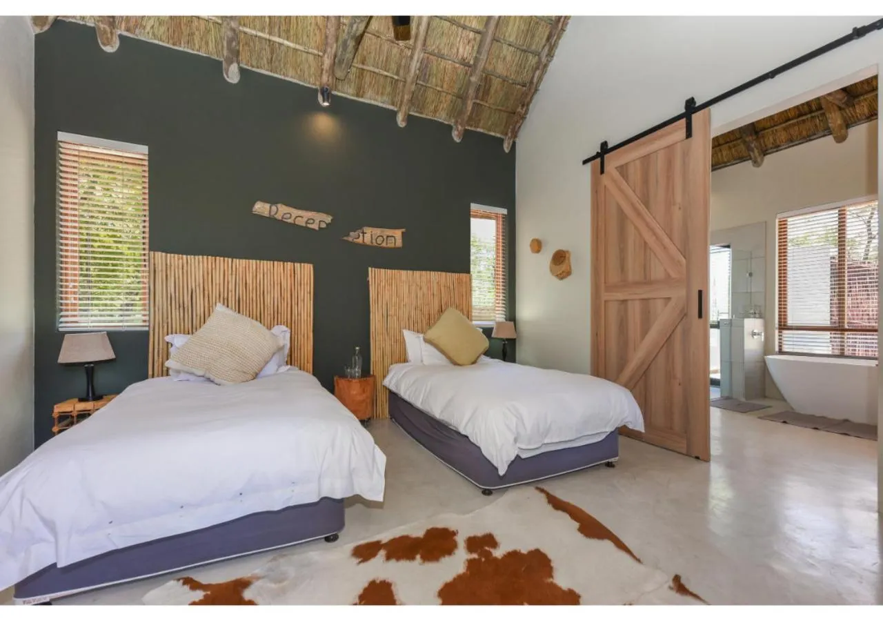 Bed in Mziki Safari Lodge